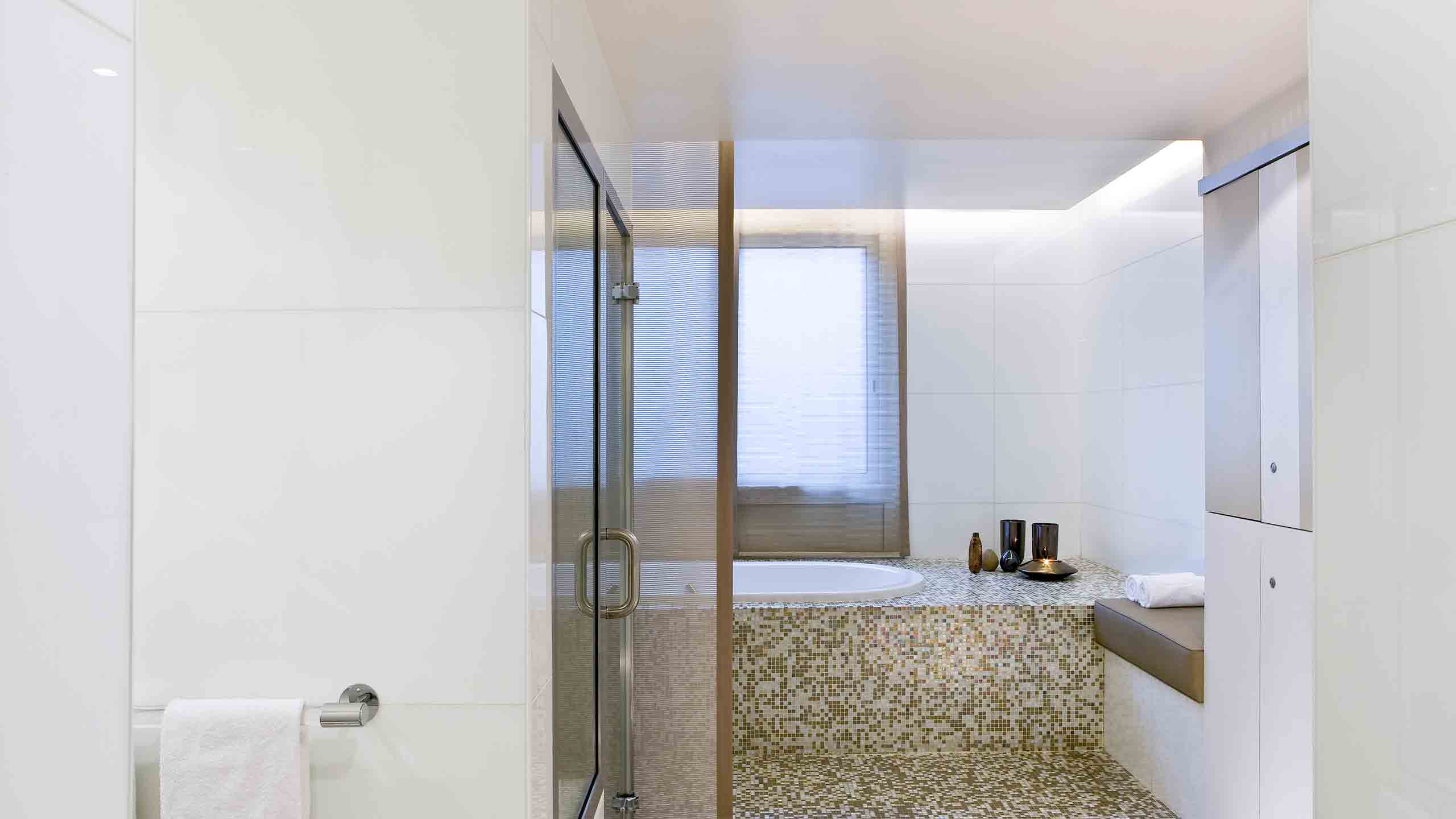 a bathroom with a bathtub and shower