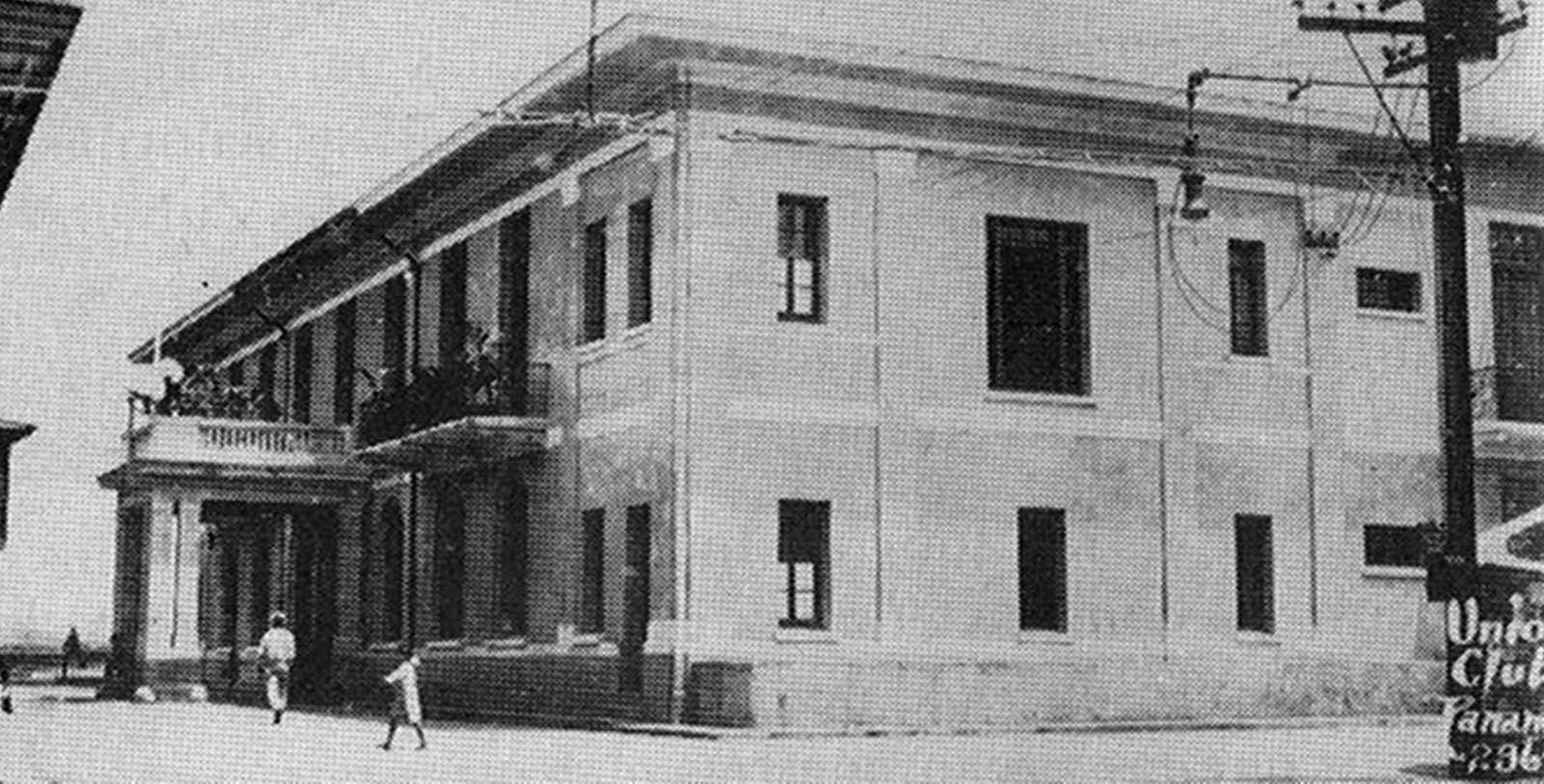 a building with people walking in front of it