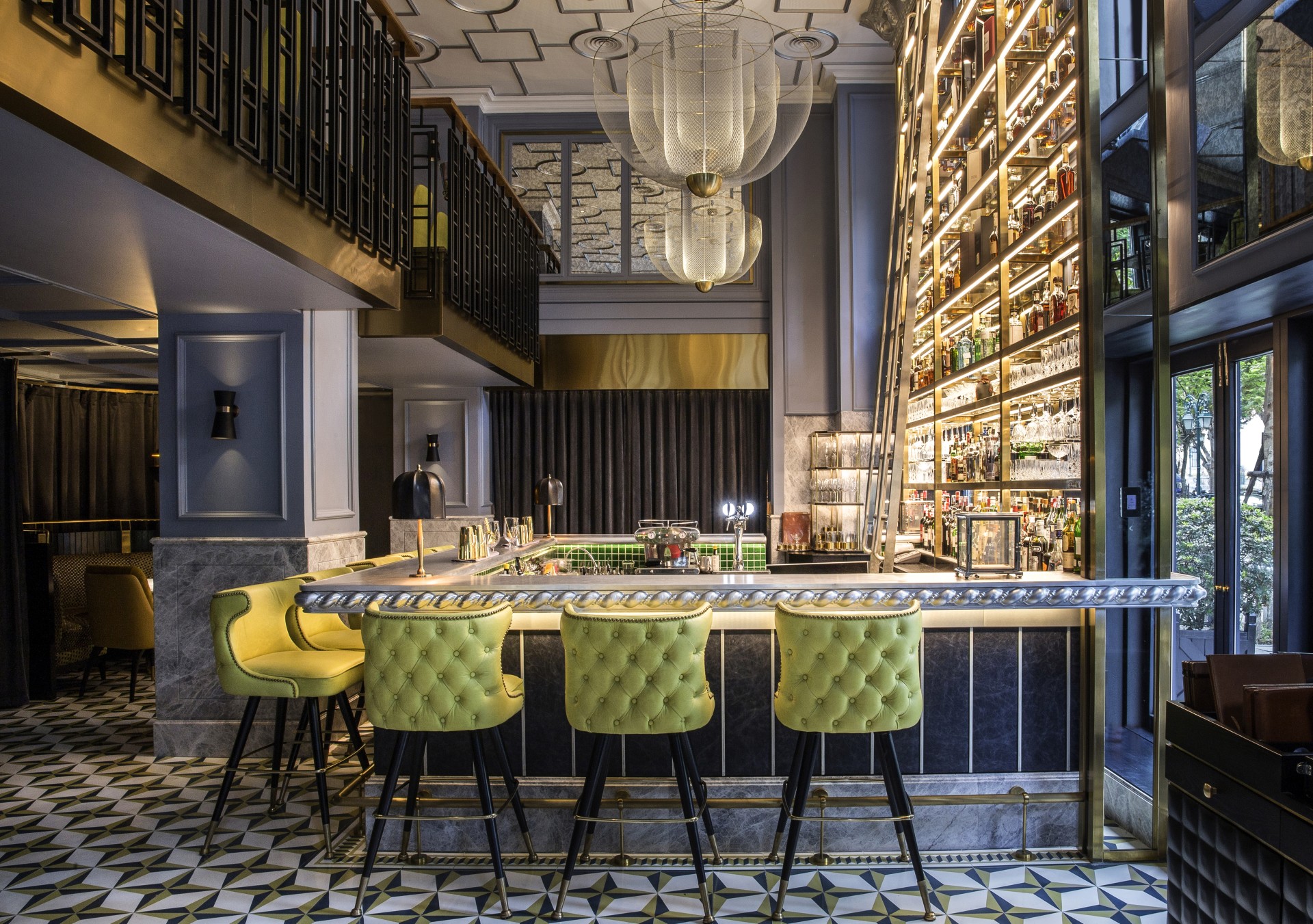 a bar with a bar stools and a bar with shelves