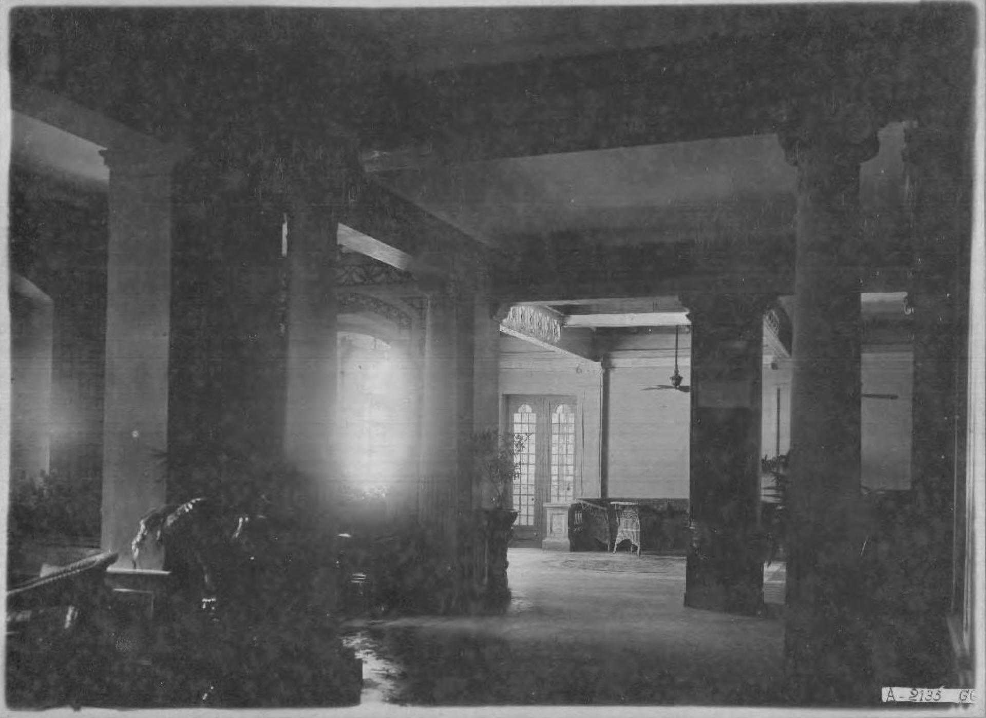 a room with columns and a light