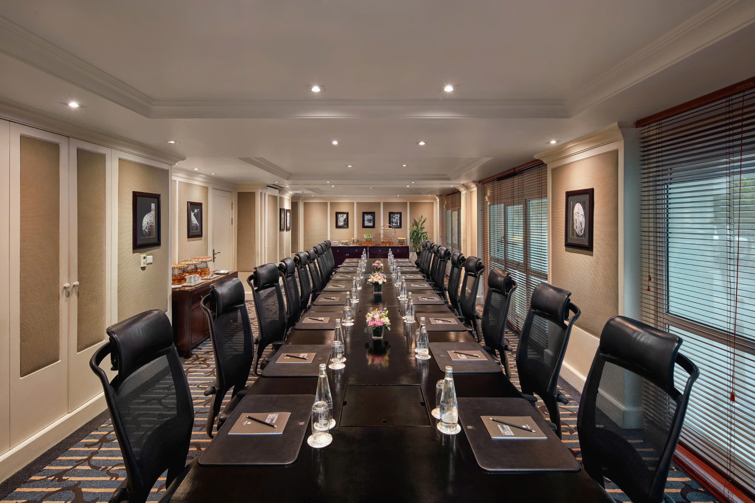 a conference room with a long table and chairs