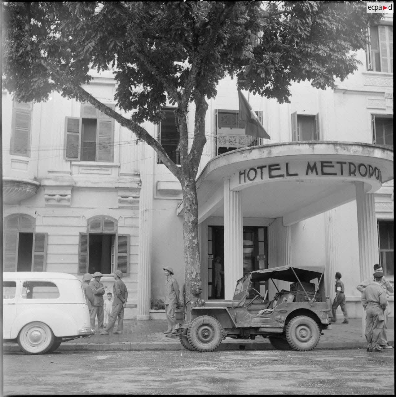 a military jeep outside a hotel