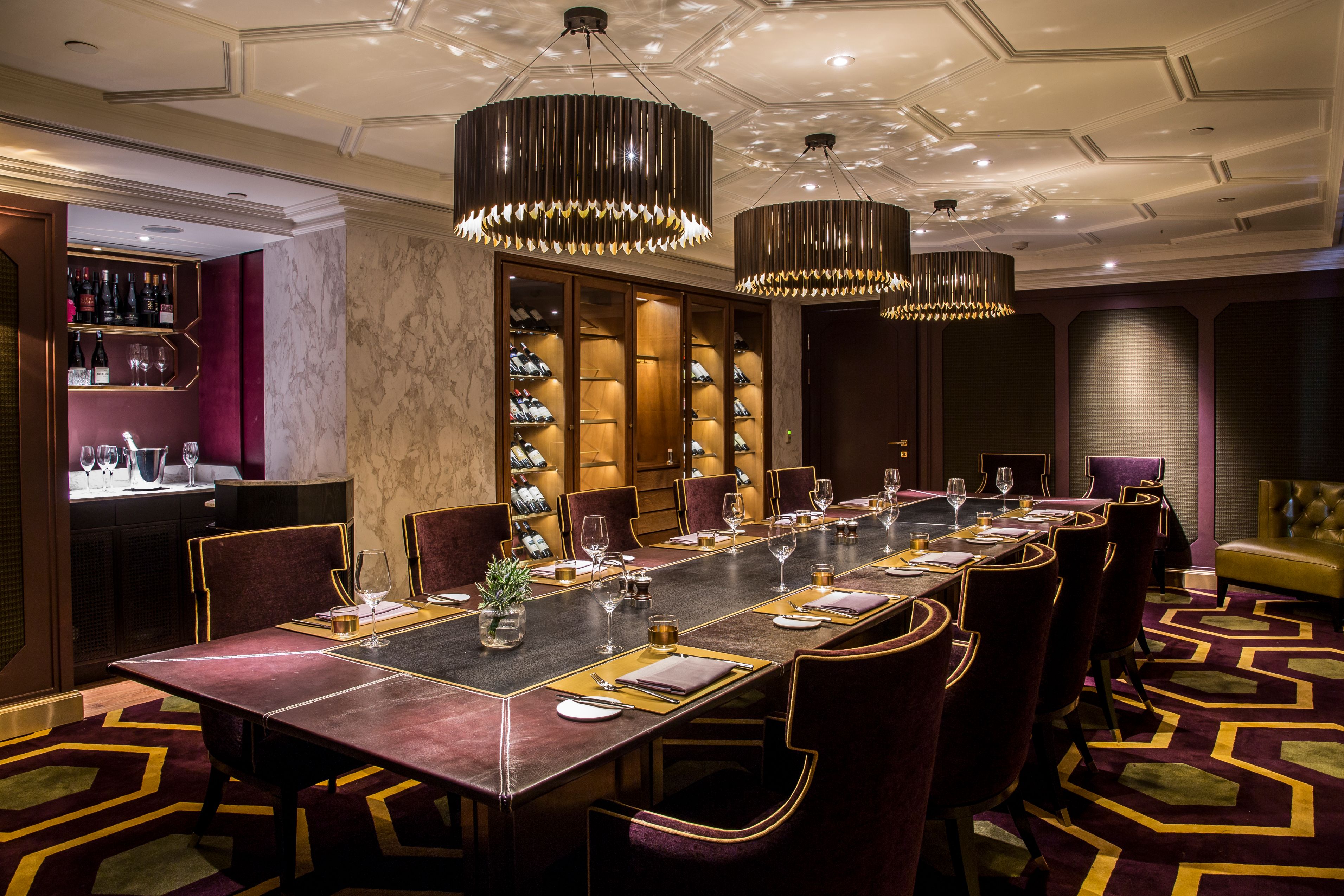 a large table with chairs and a chandelier