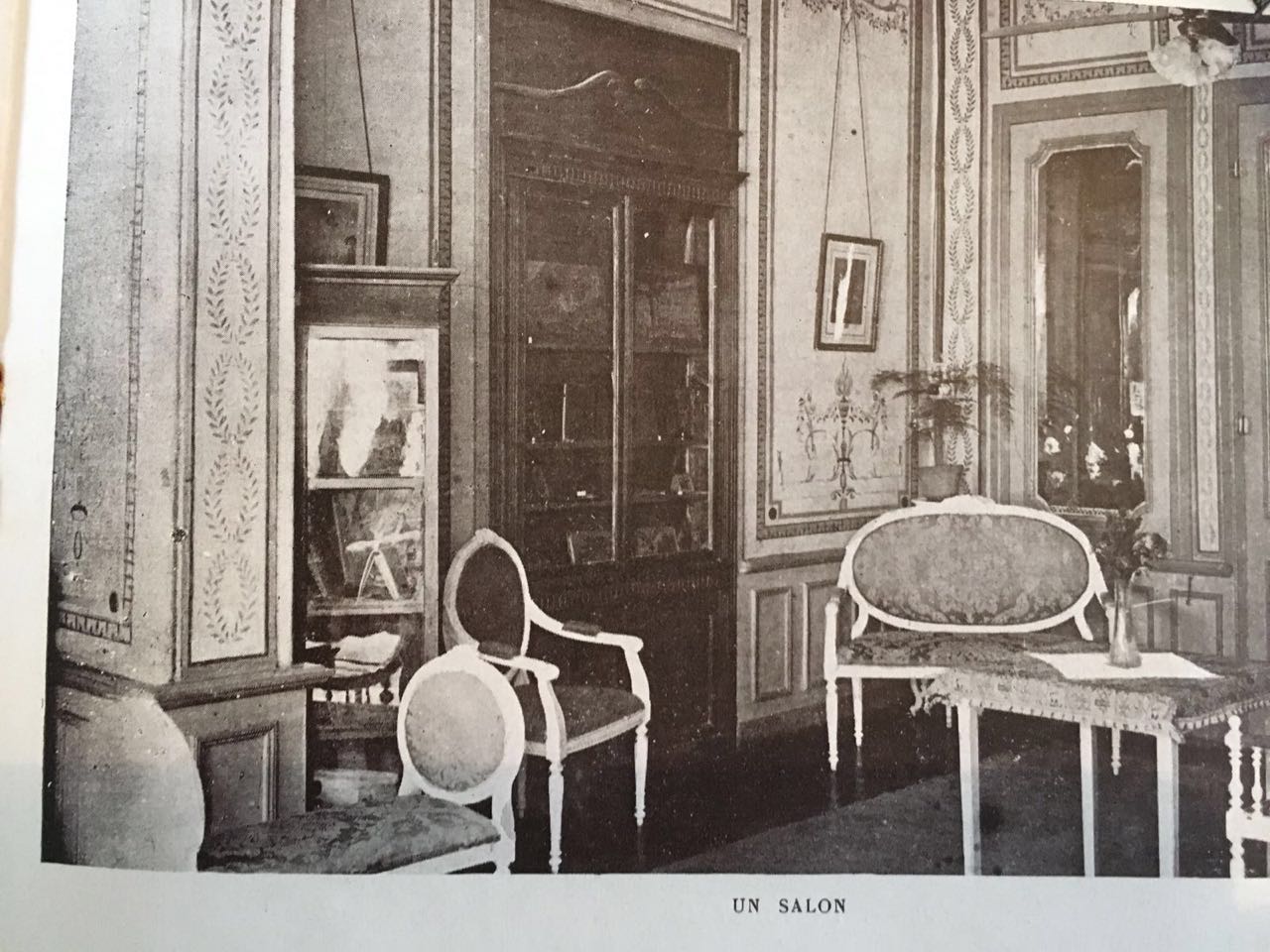 a room with chairs and a bookcase