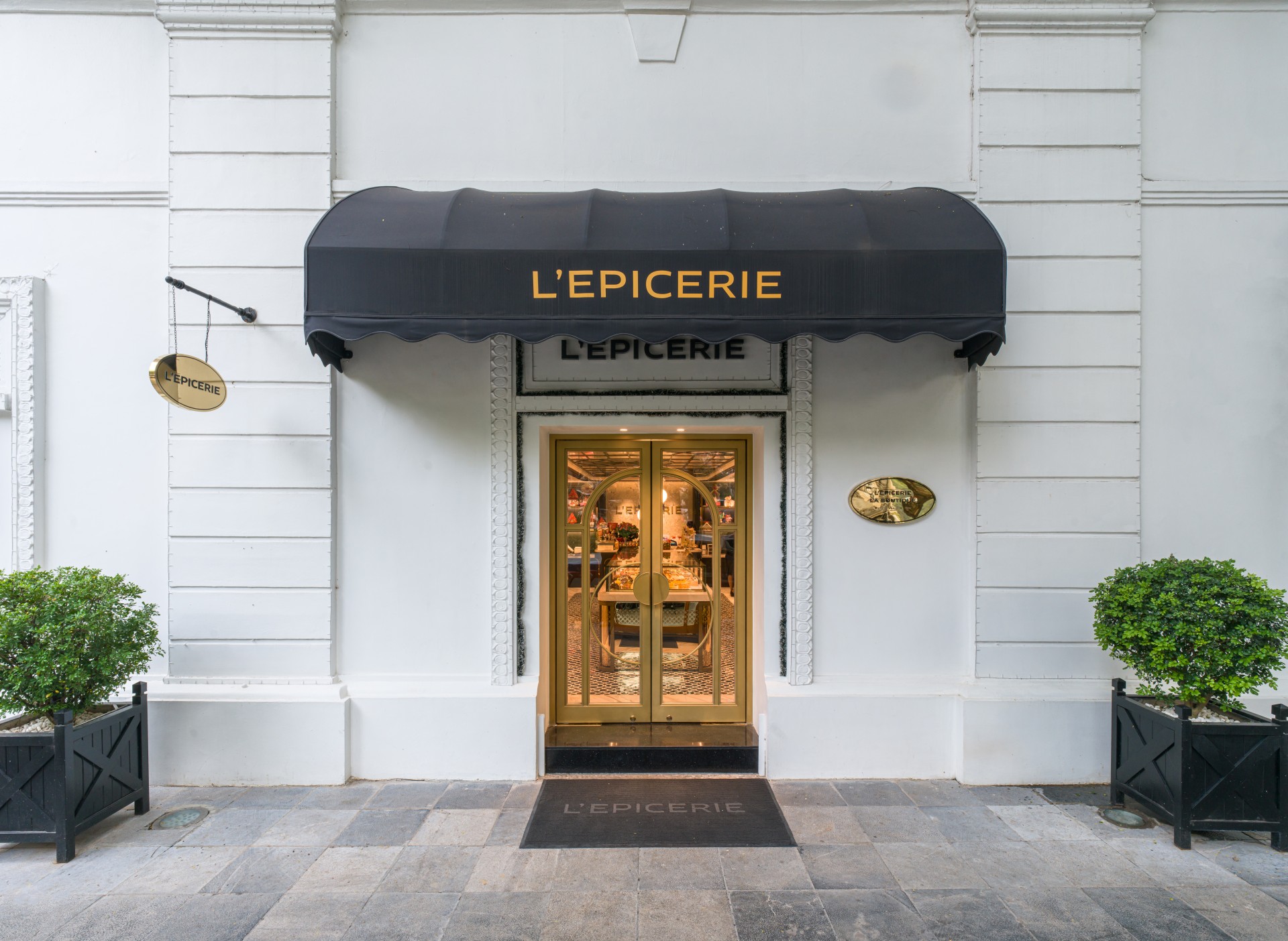 a front of a building with a black awning