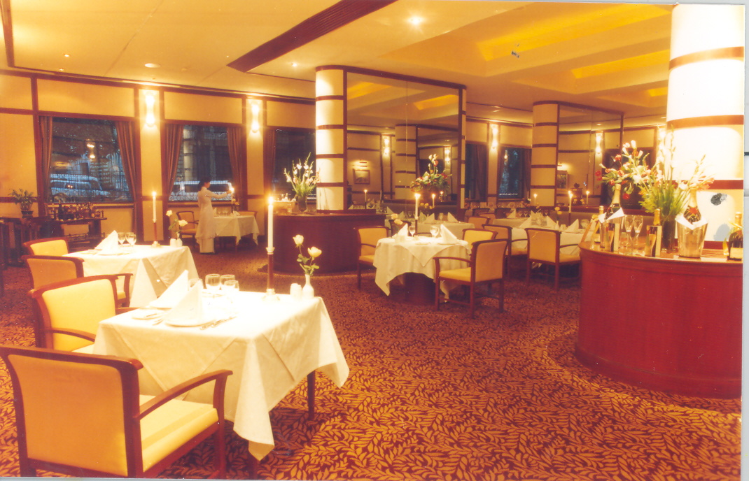a restaurant with tables and chairs