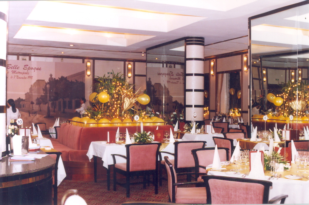 a restaurant with tables and chairs