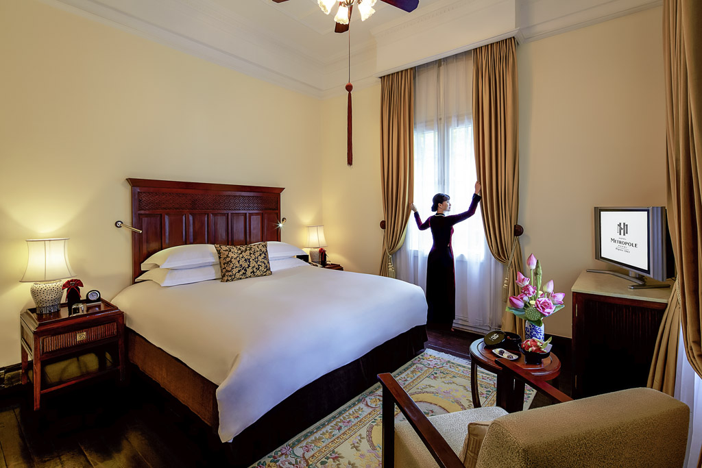 a woman standing in a hotel room