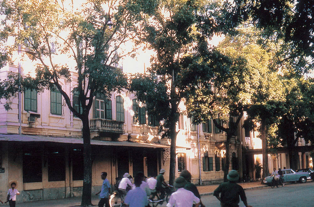a group of people riding bicycles on a street