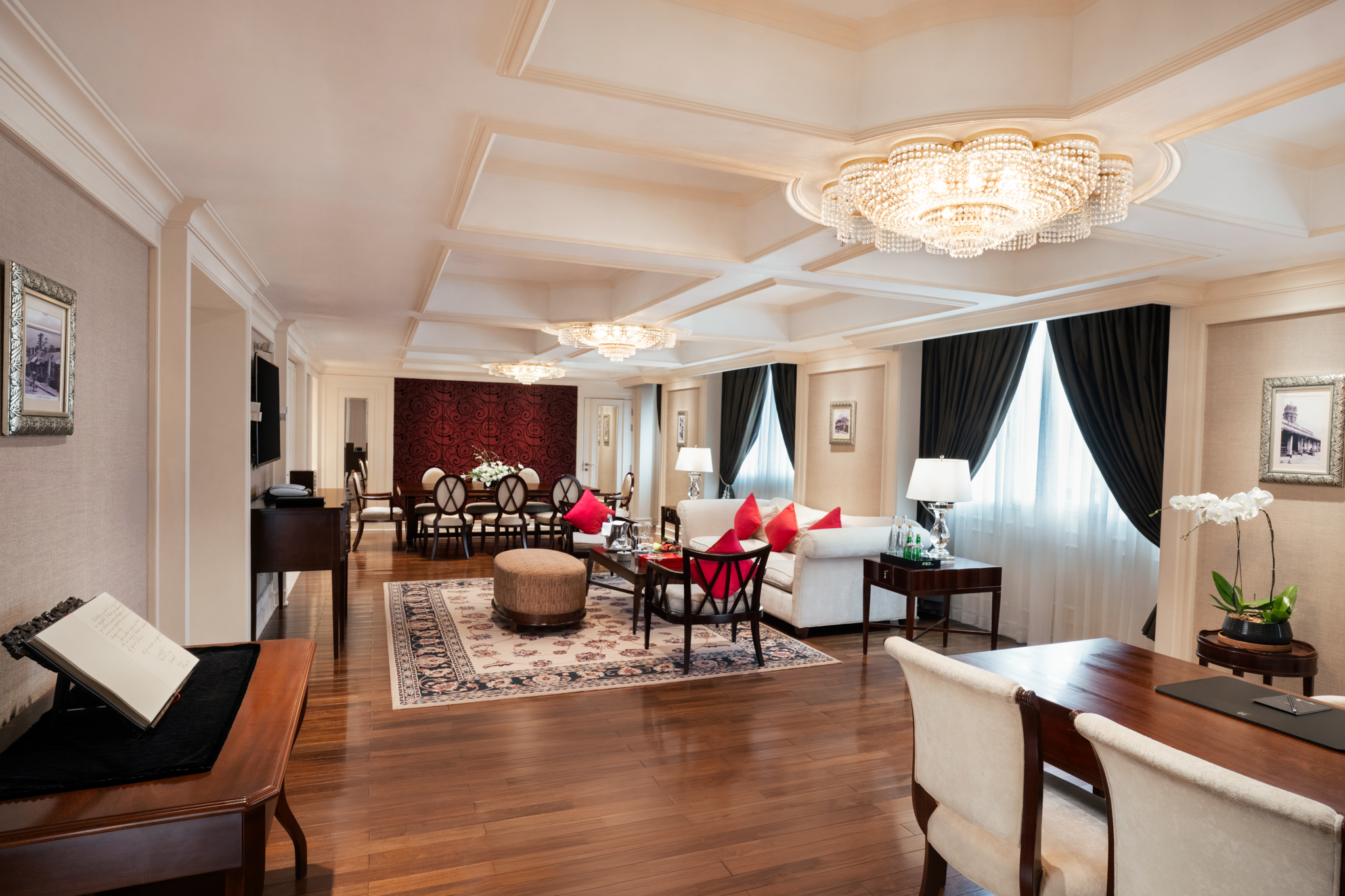 a room with a chandelier and a couch