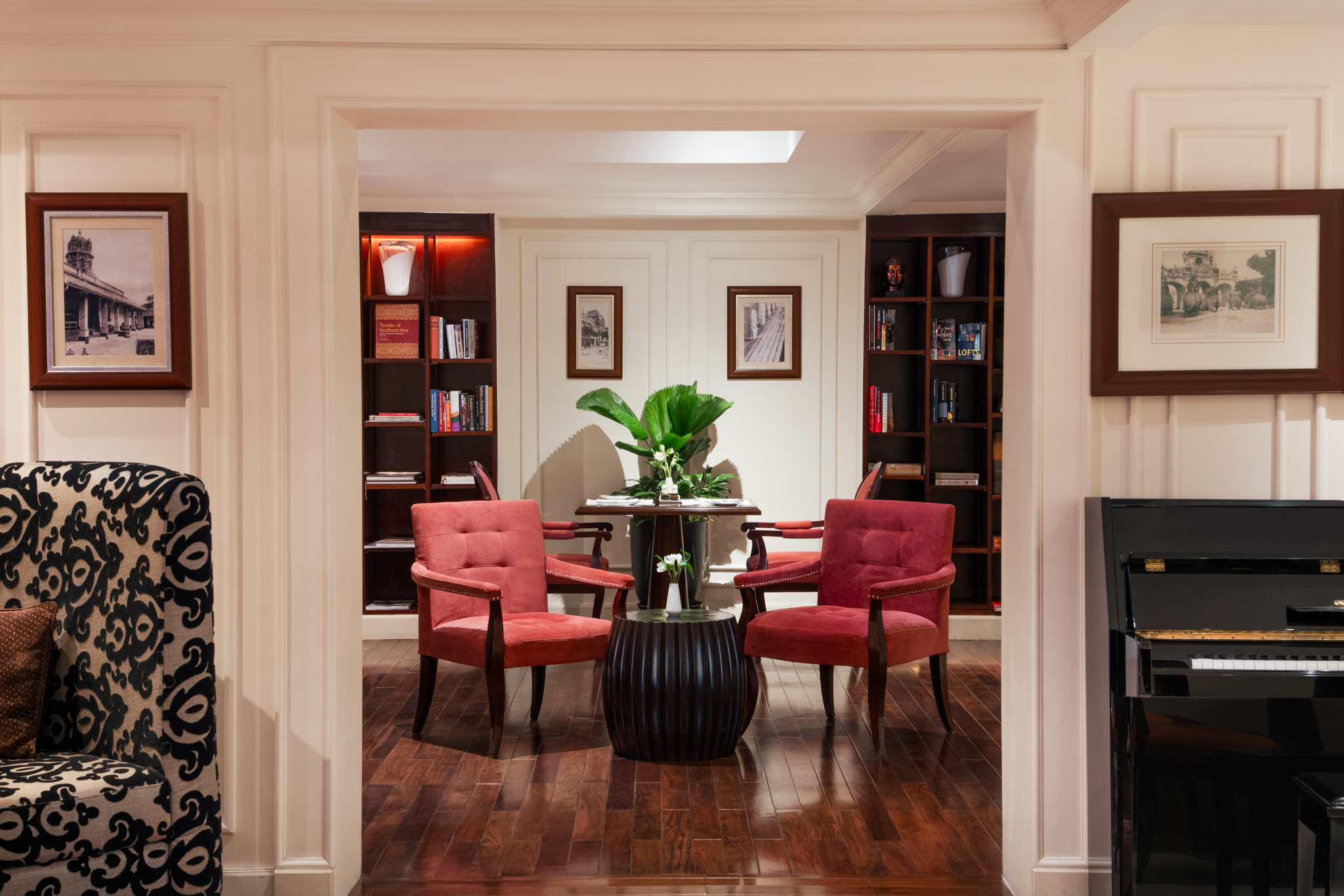 a room with red chairs and a table