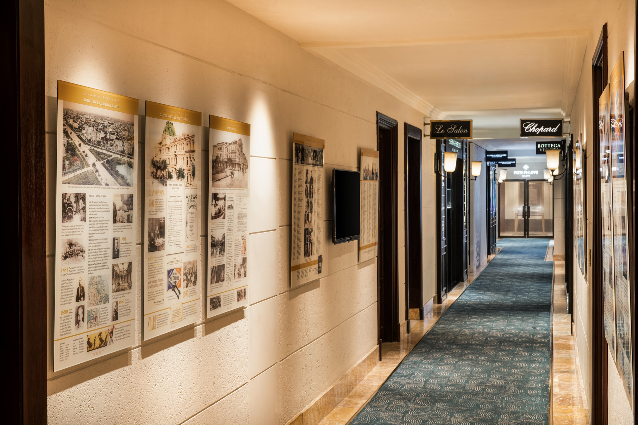 a long hallway with posters on the wall