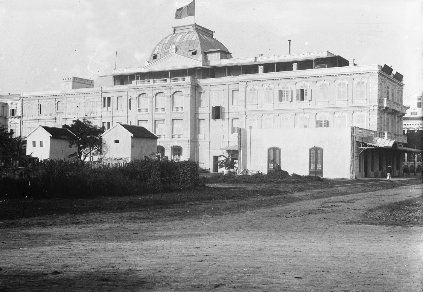 a large building with a flag on top