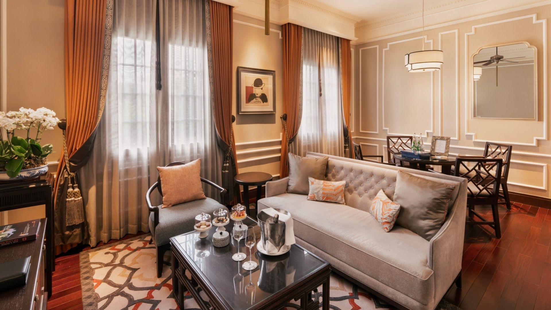 a living room with a couch and chairs