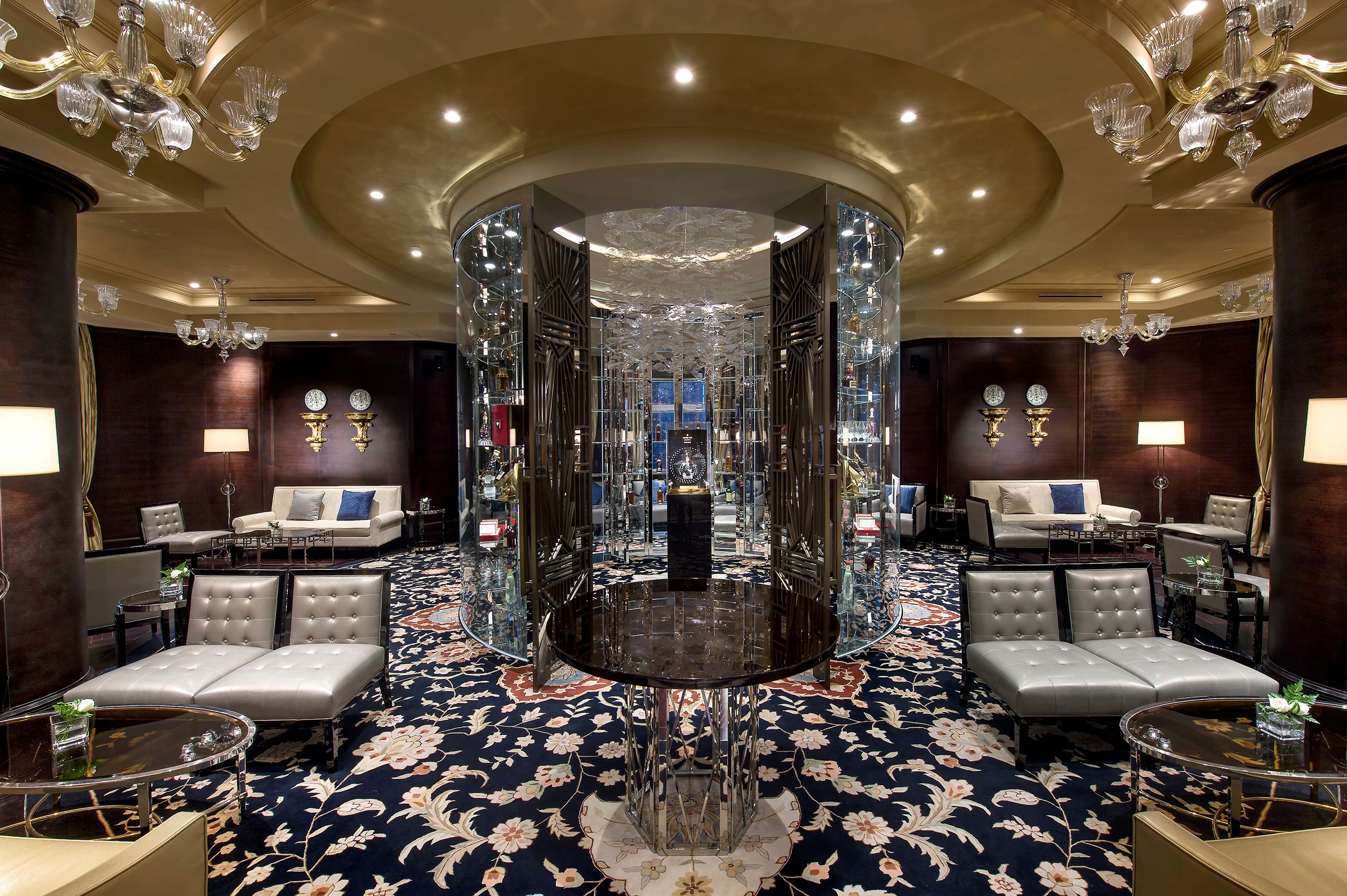 a room with a round table and chairs
