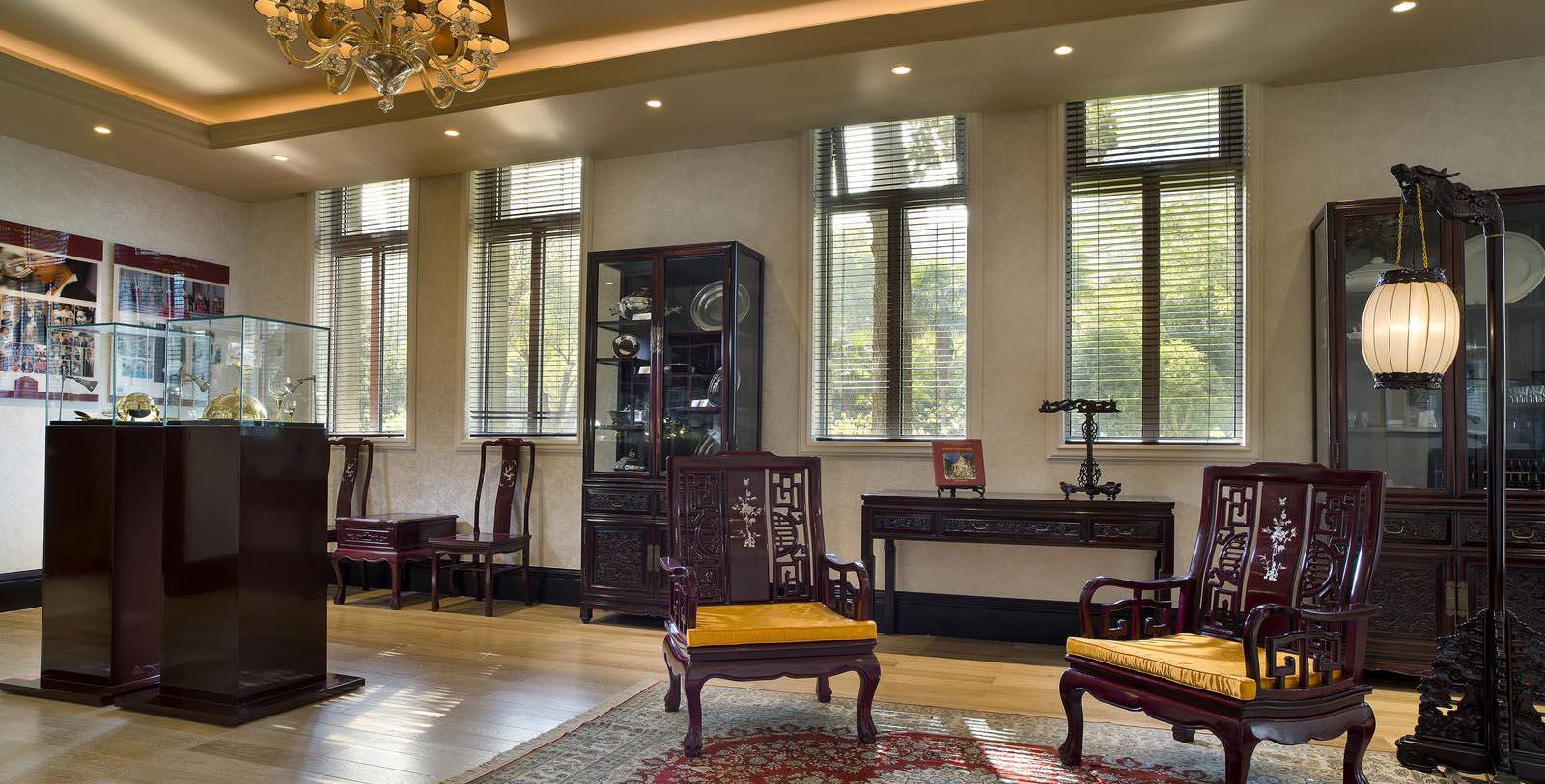 a room with a chandelier and chairs