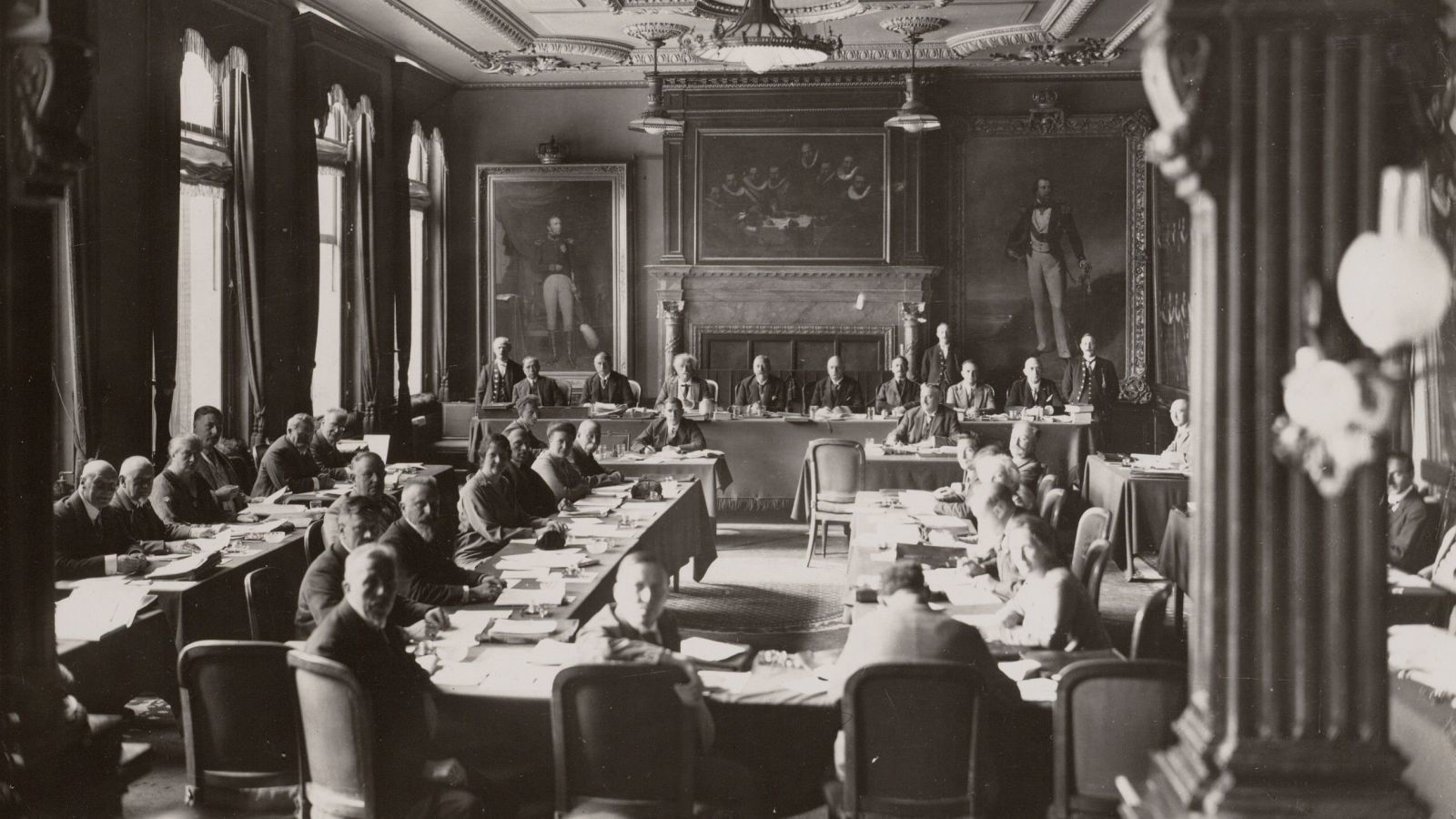a group of people sitting at tables in a room