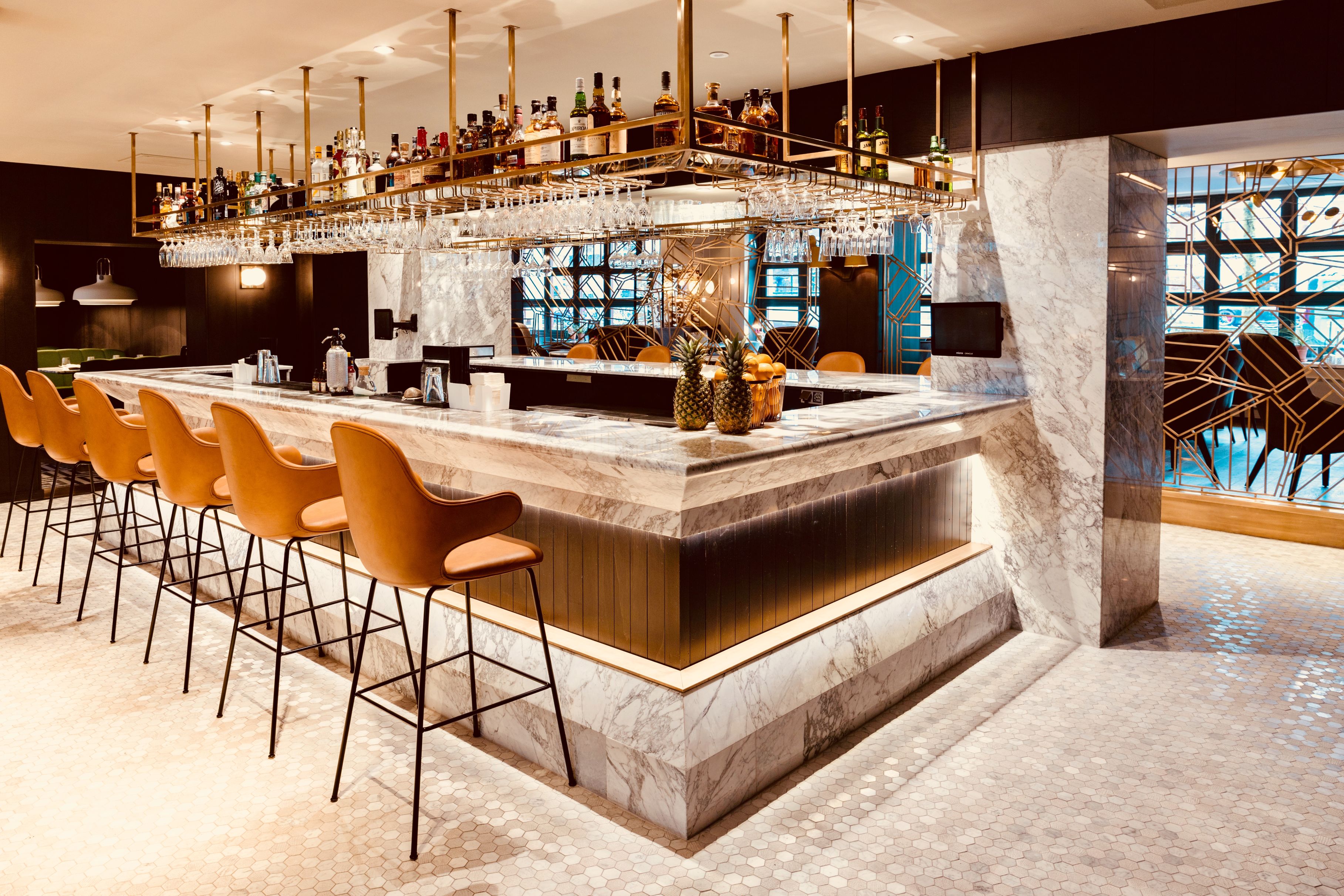 a bar with a bar and chairs