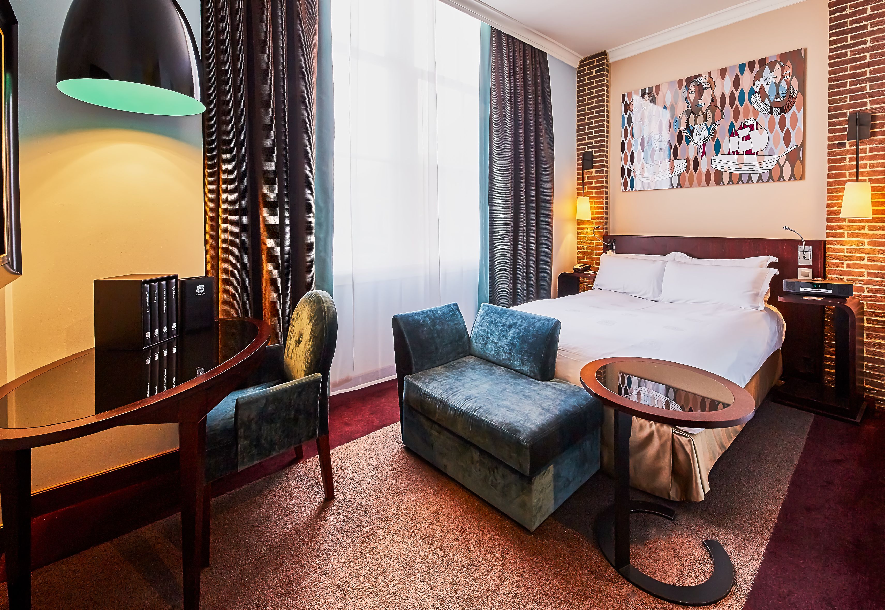 a room with a bed and chair