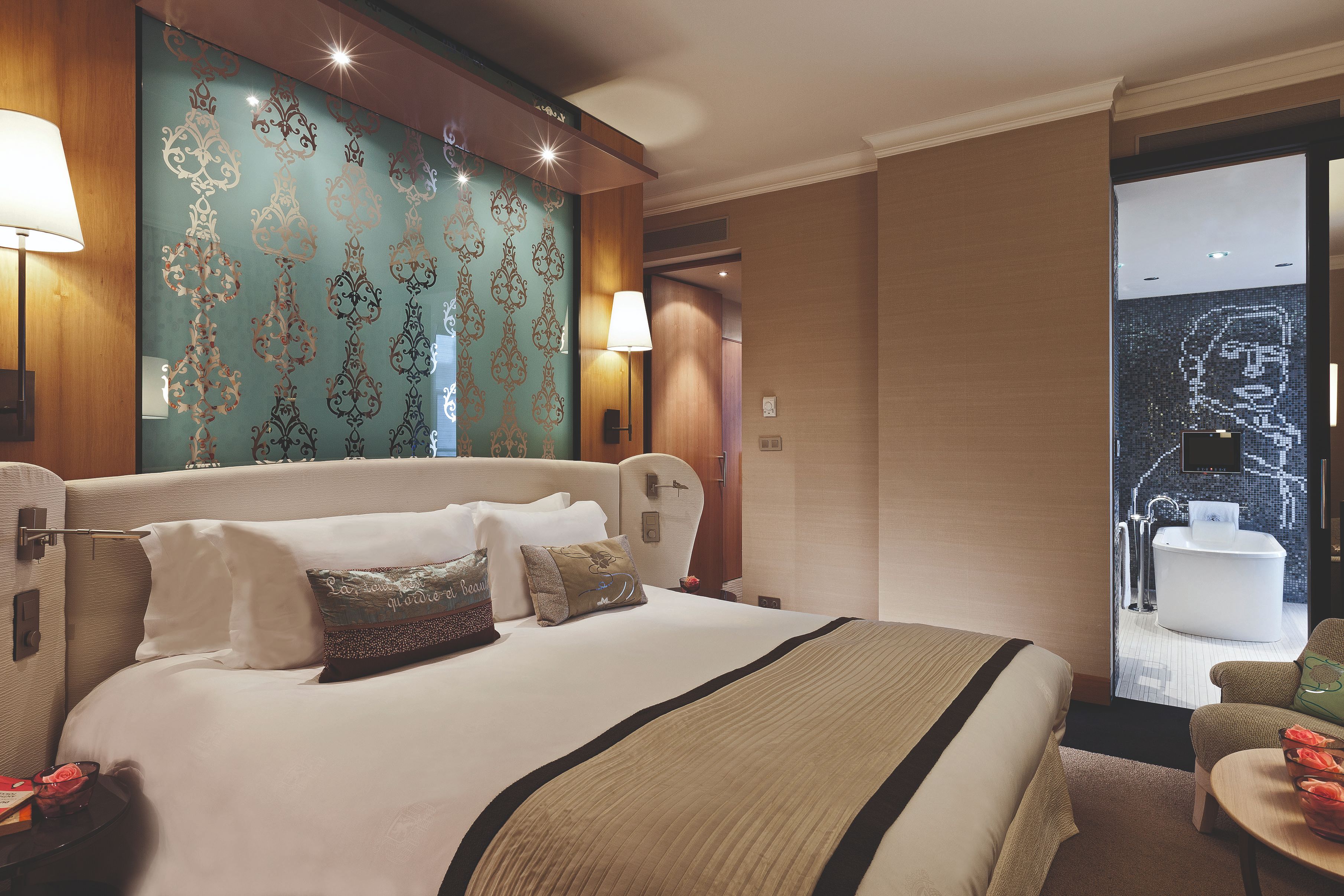 a bed with pillows in a room