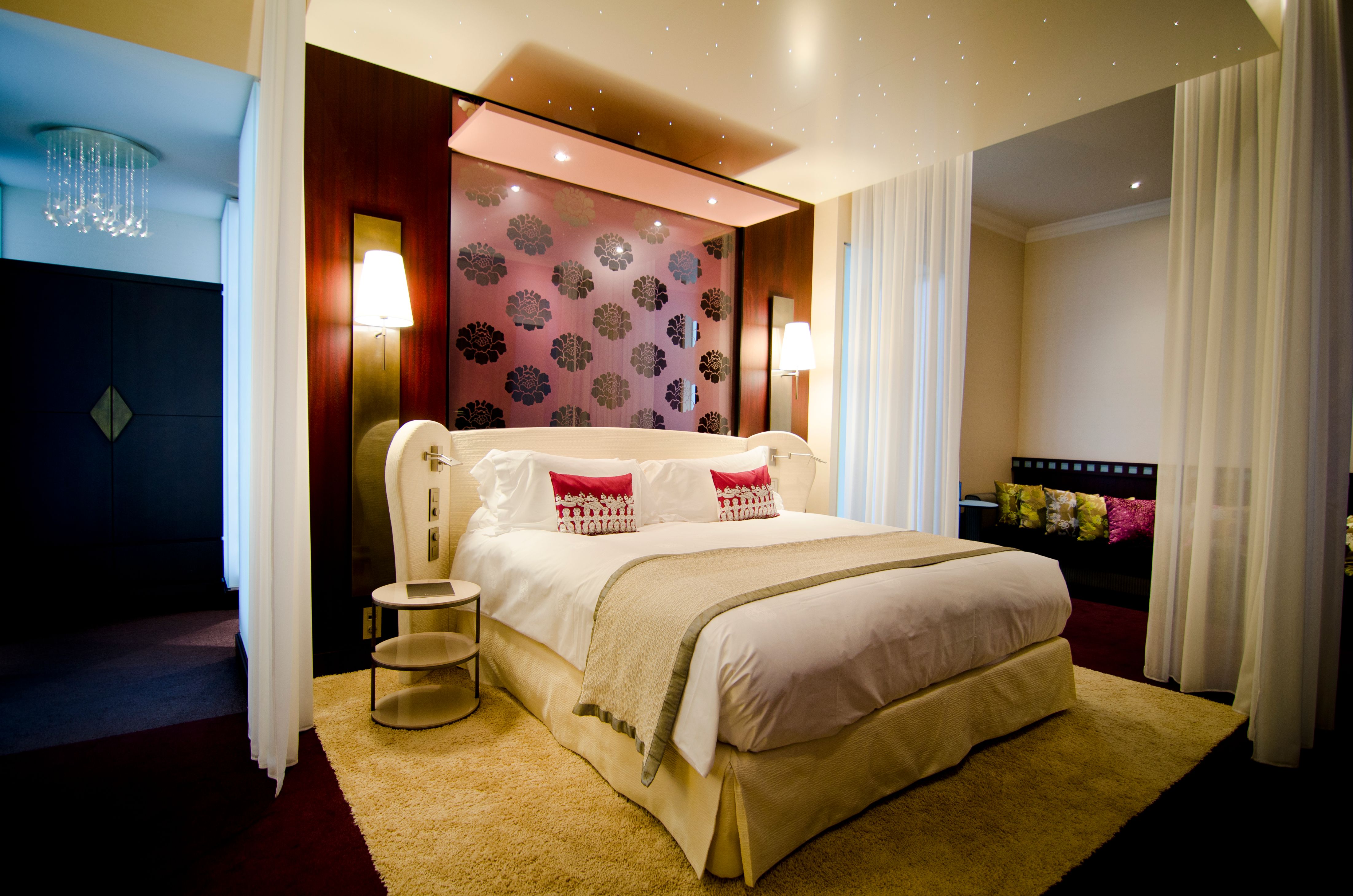 a bed with a mirror above it