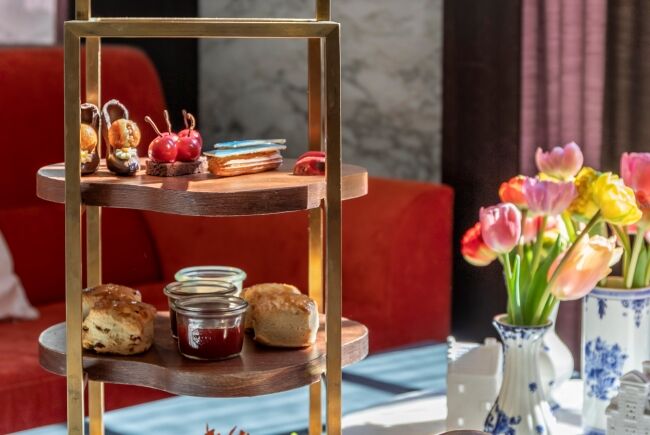 a three tiered tray with food on it