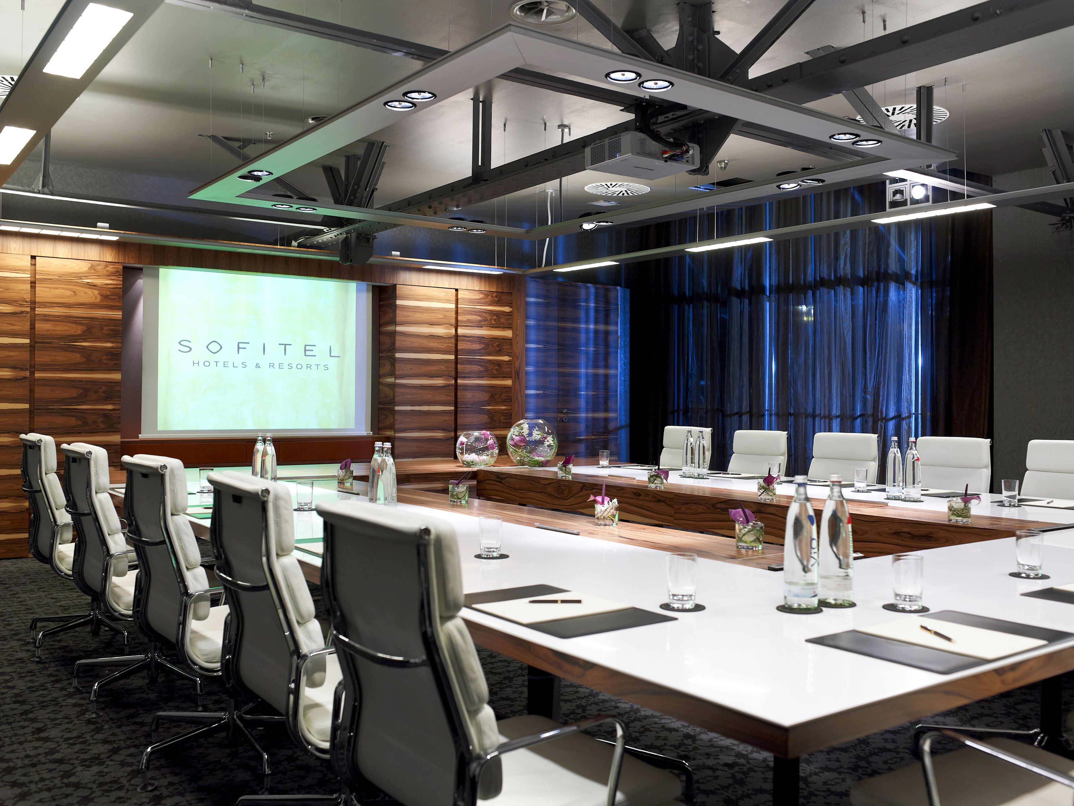 a conference room with a large table and chairs