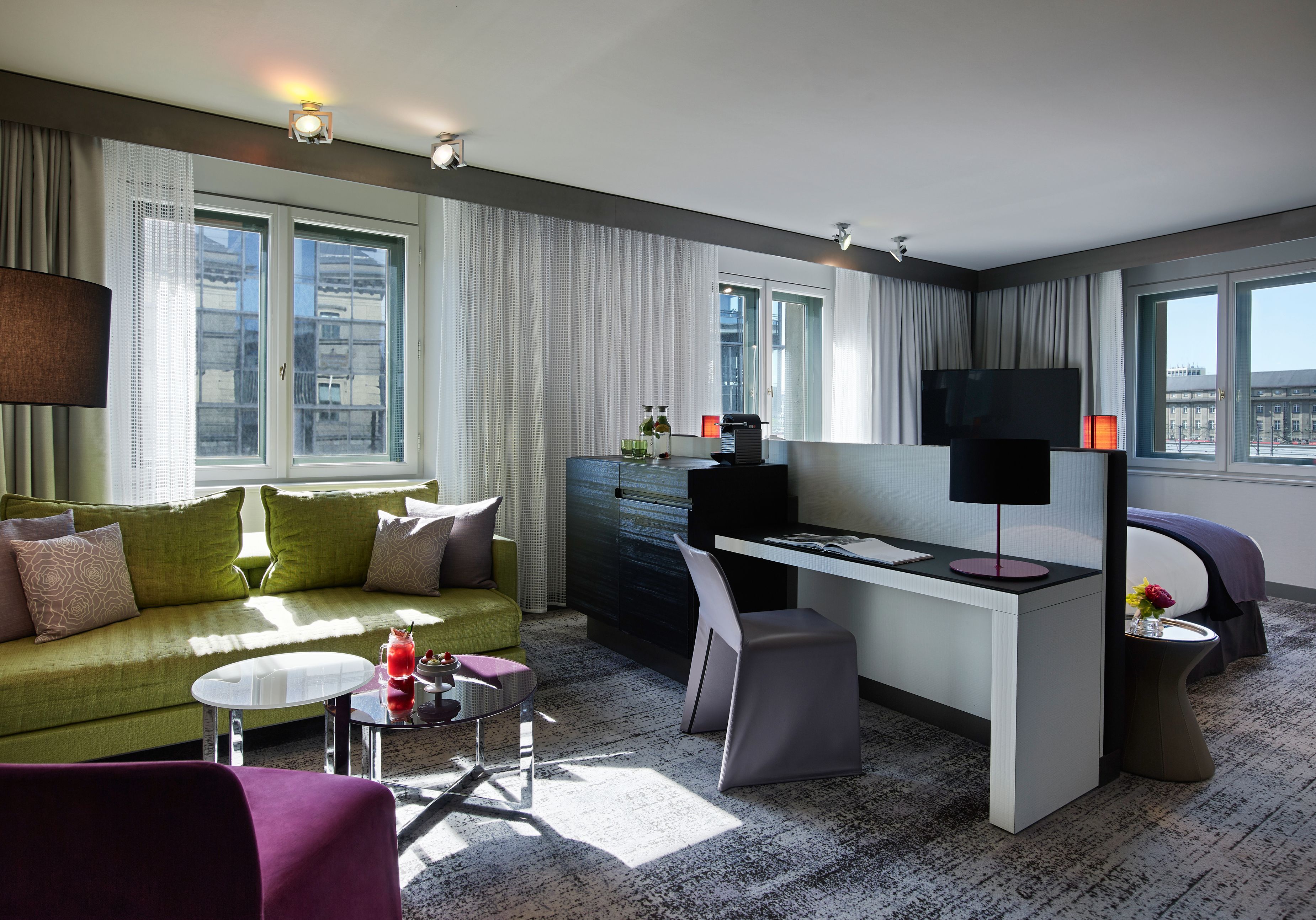 a room with a couch and a desk