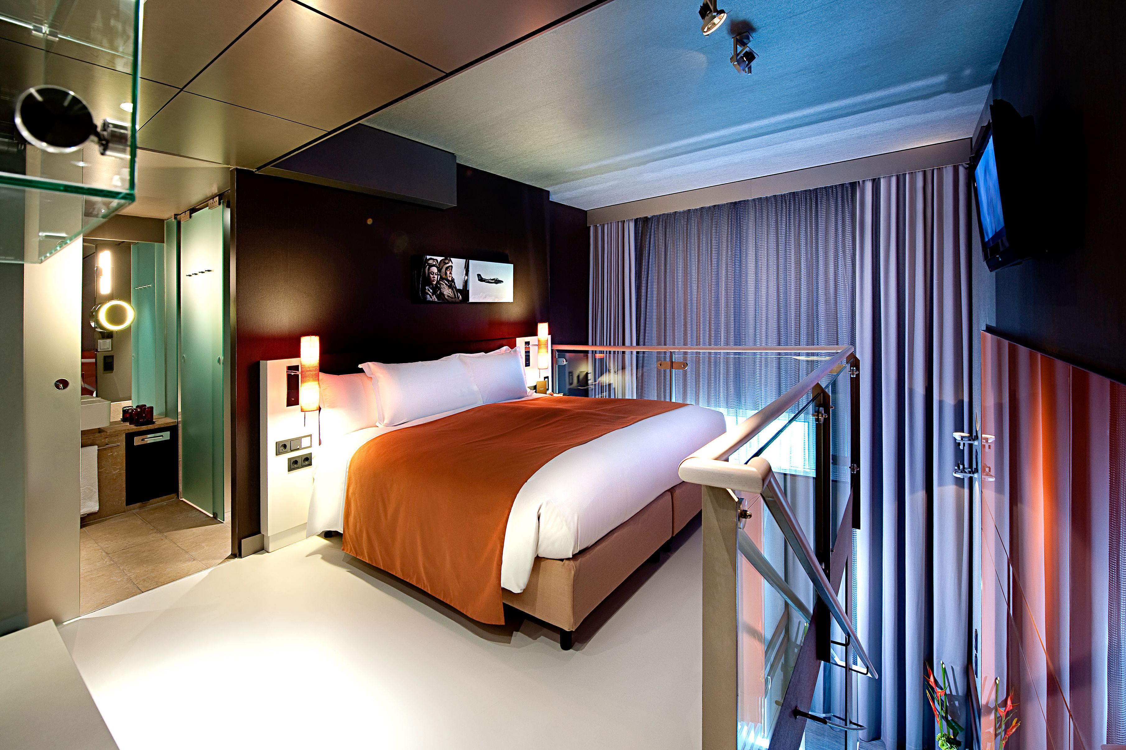 a bed with a metal railing