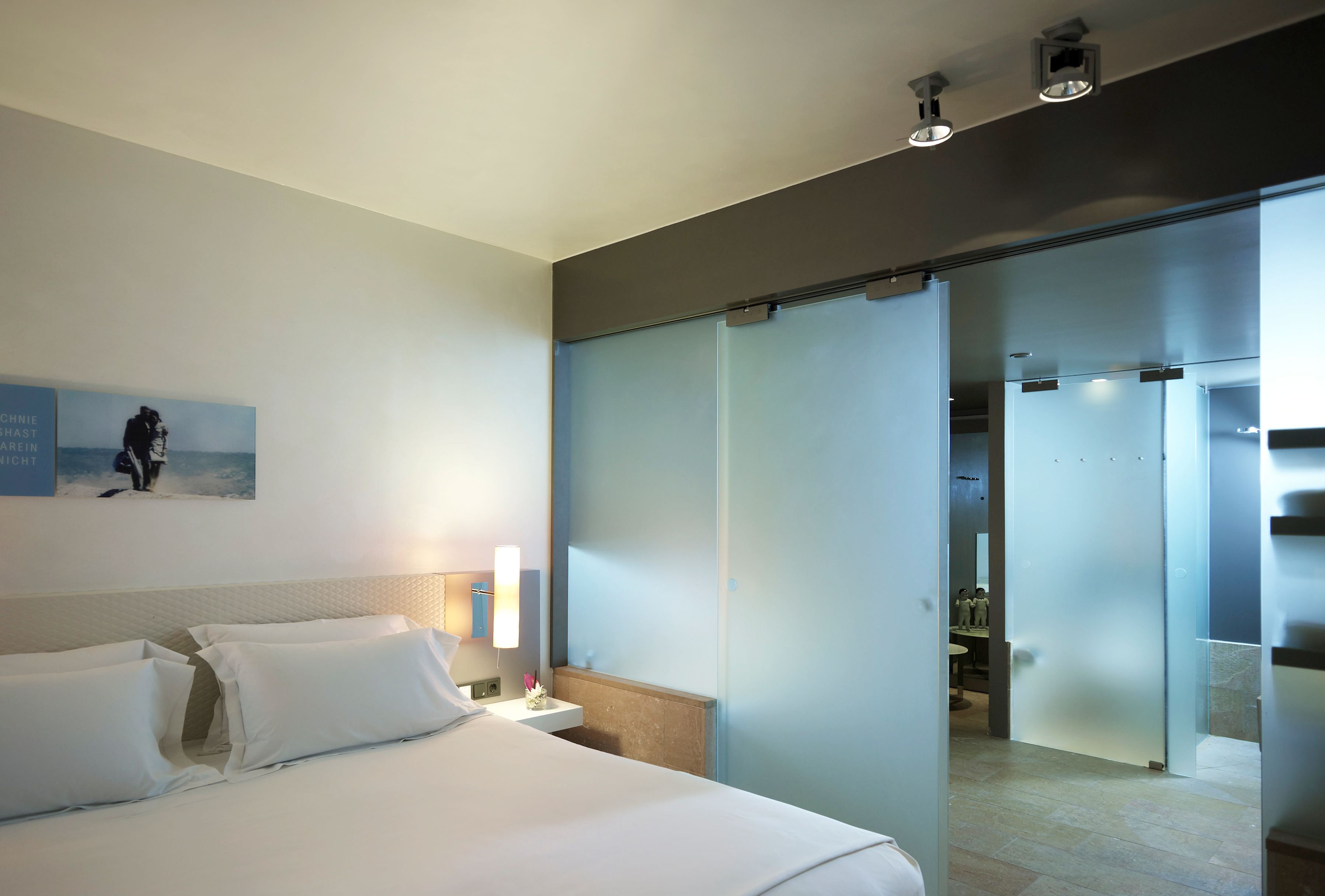 a bed with a glass door