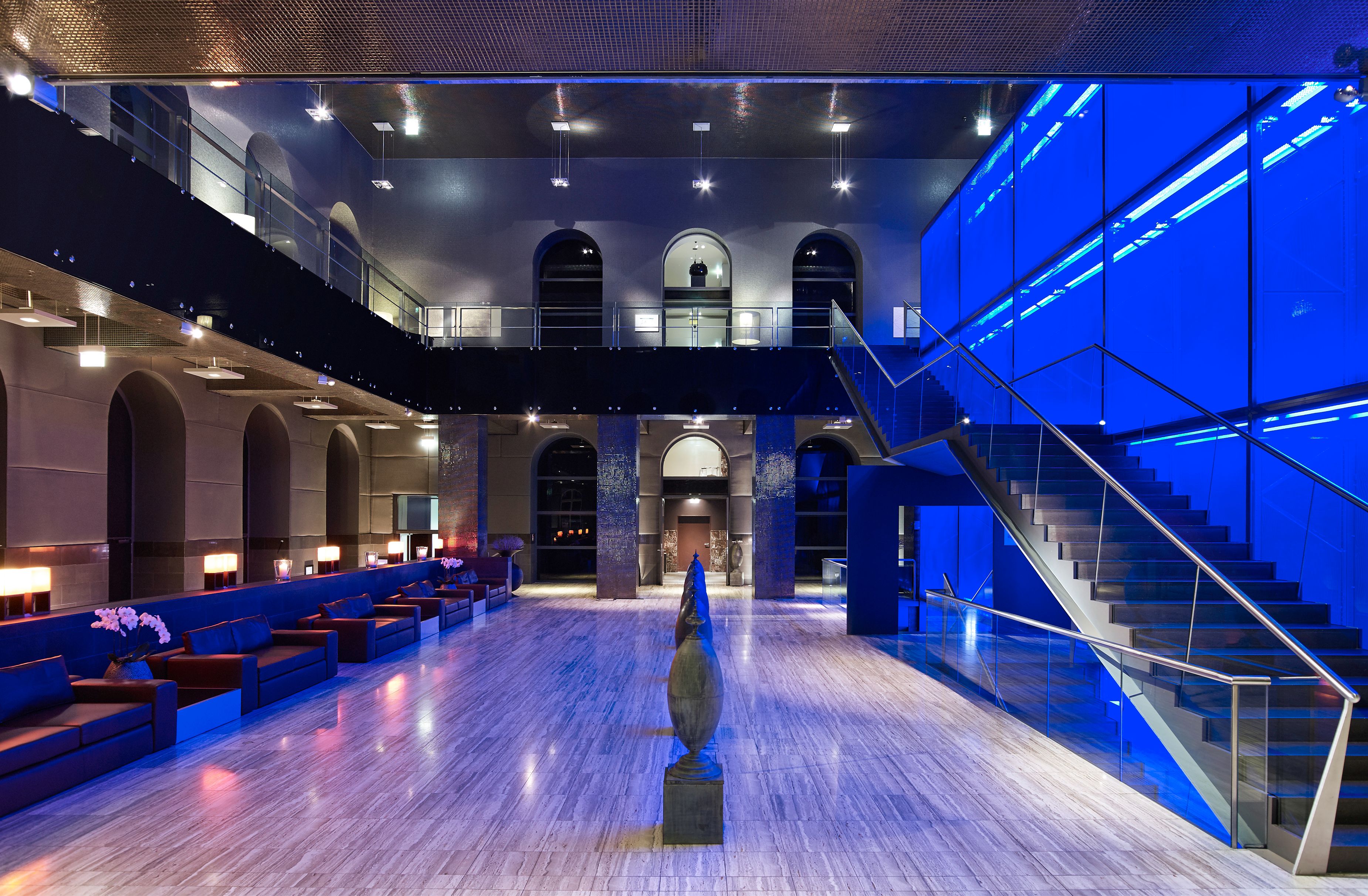 a large room with a large screen and a large staircase