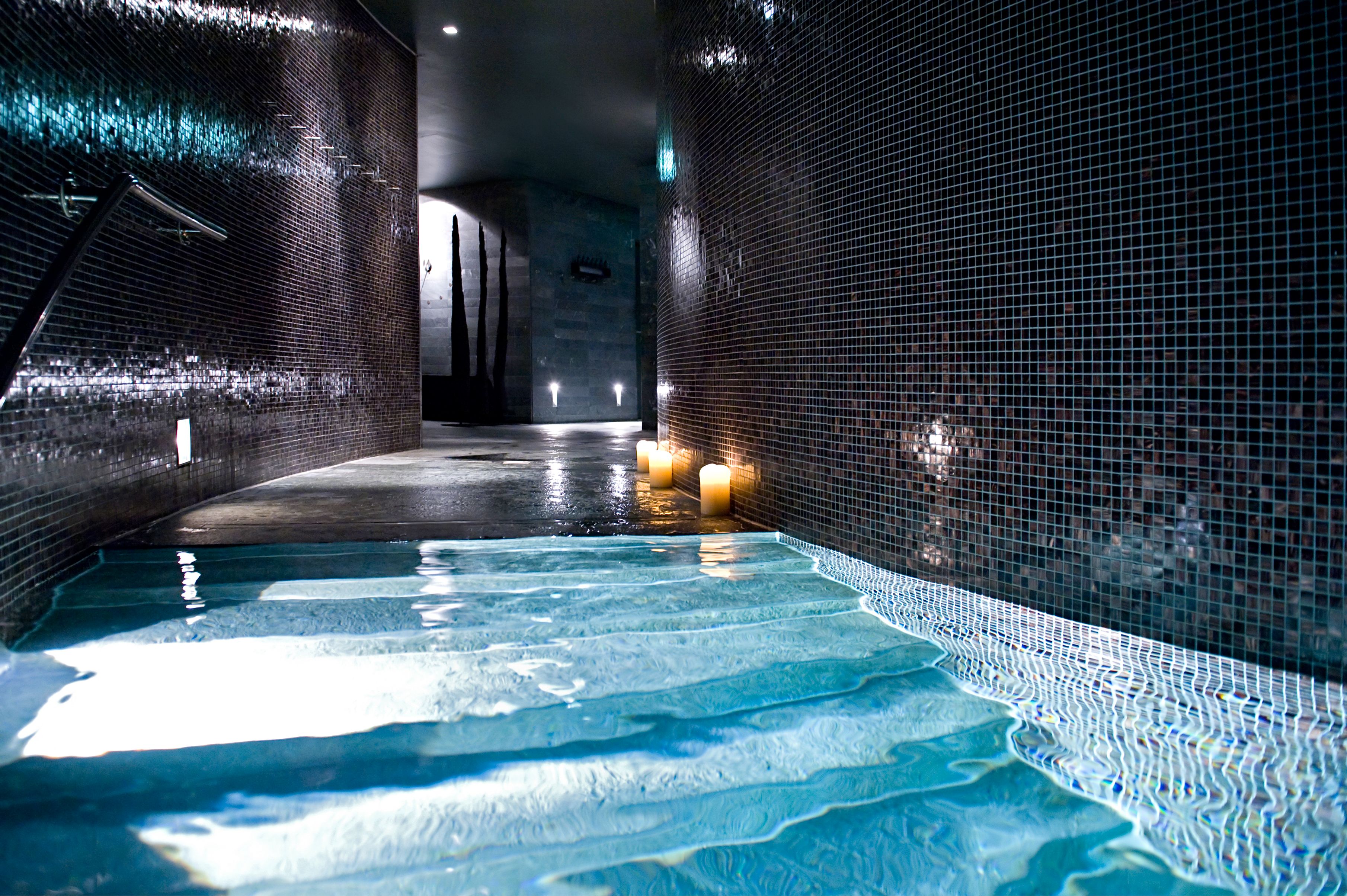 a pool with a lit candle in the middle