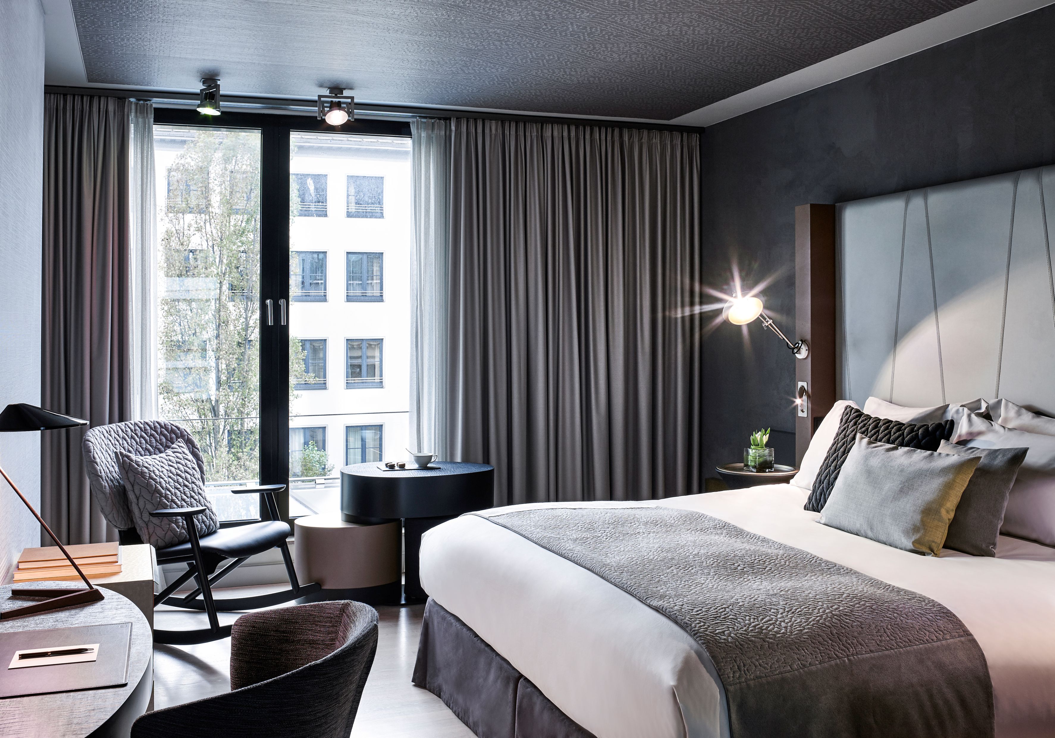 a bedroom with a bed and a chair