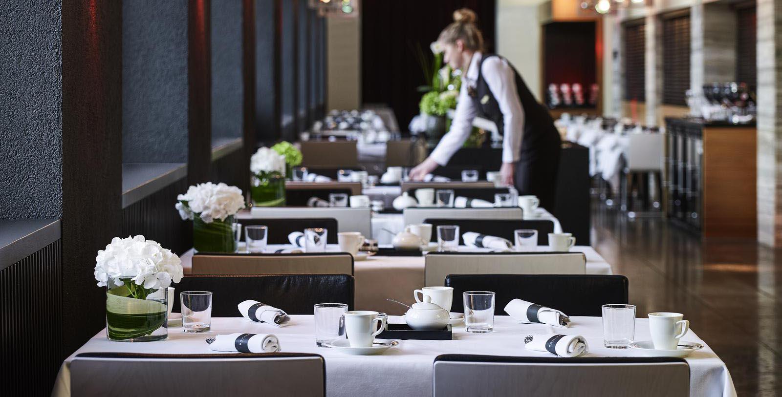a restaurant with tables and chairs