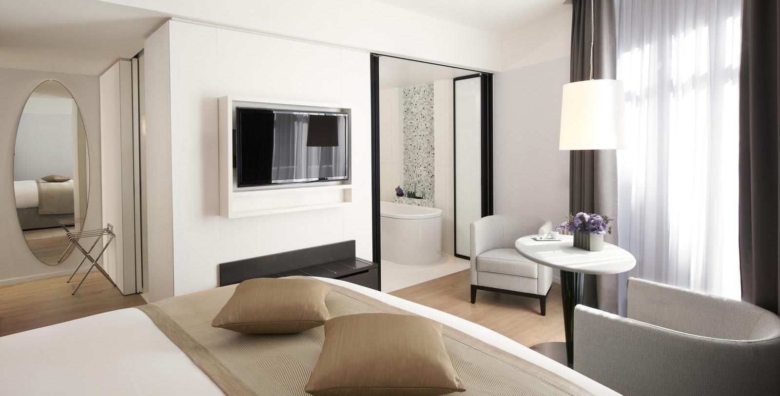 a room with a tv and a bed