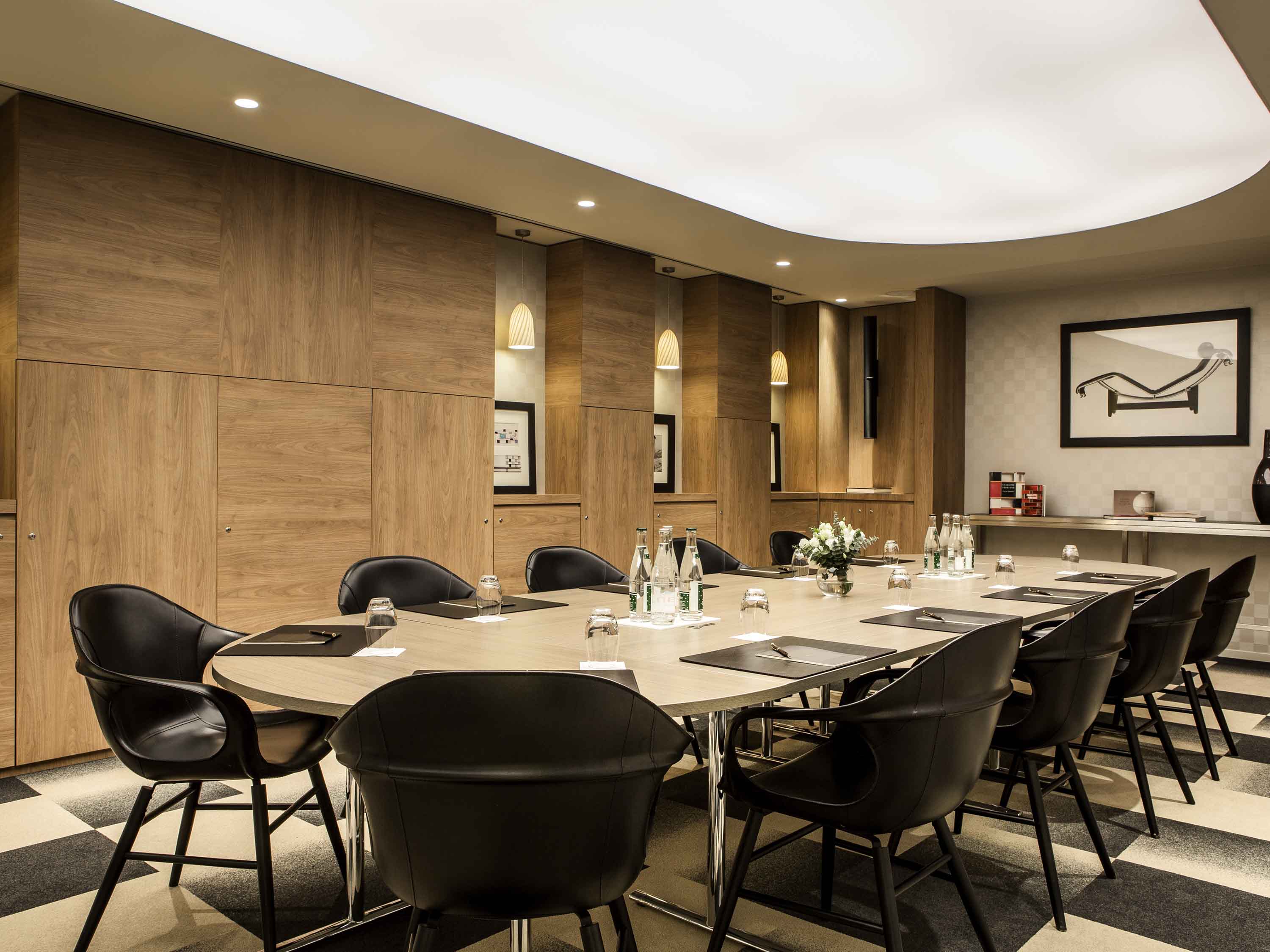 a conference room with a table and chairs