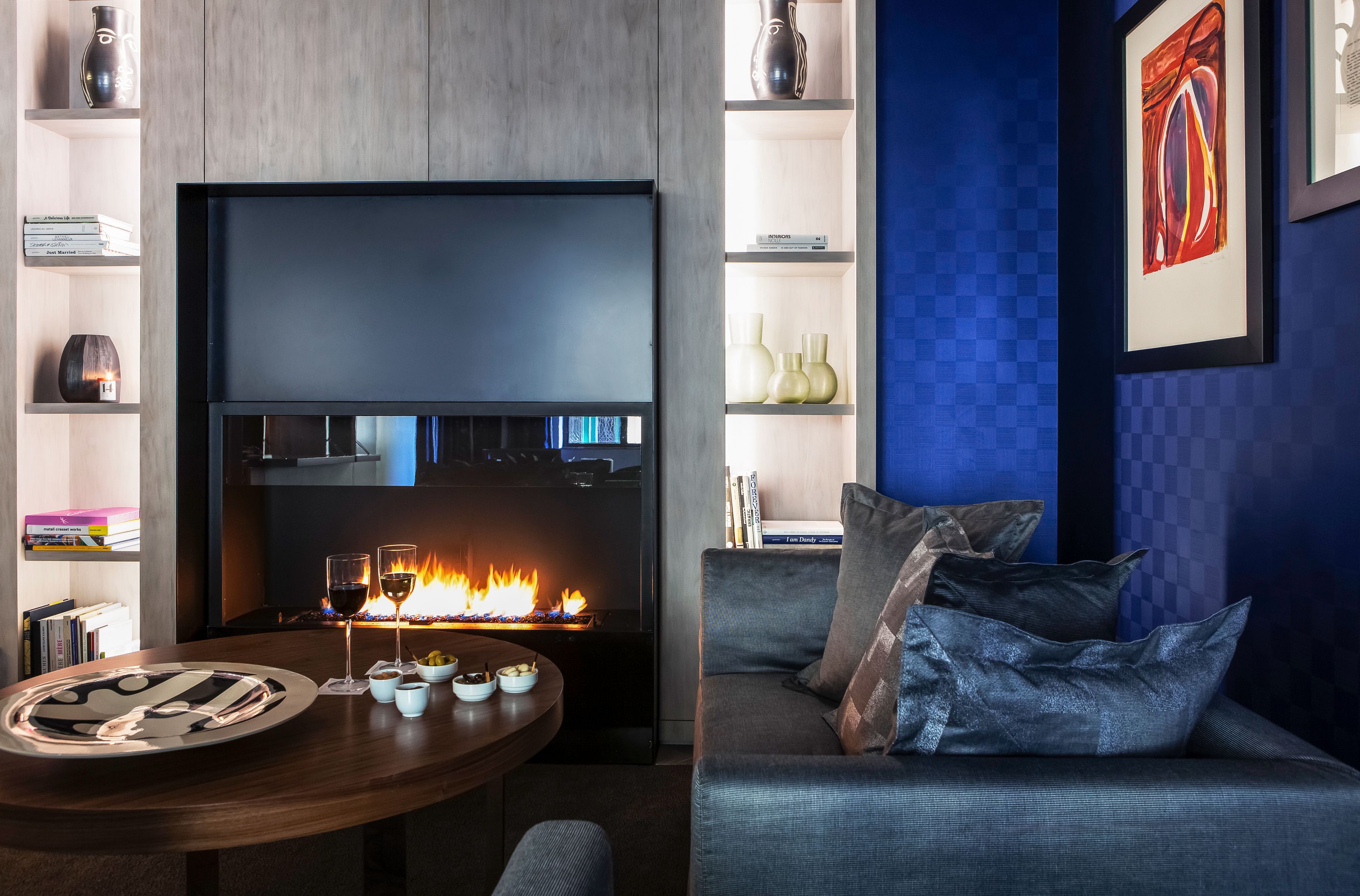 a living room with a fireplace and a couch