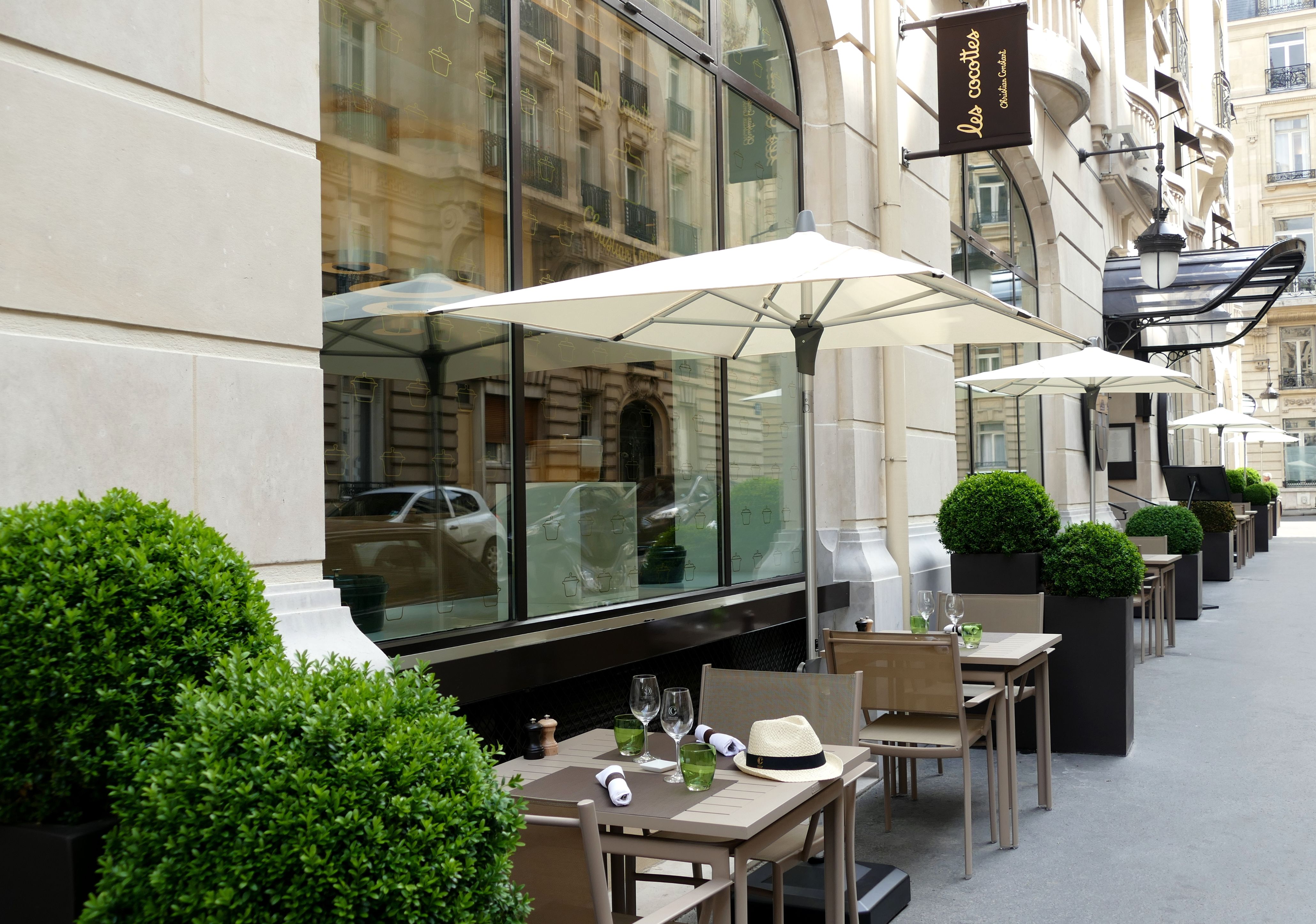 a table and chairs outside of a building