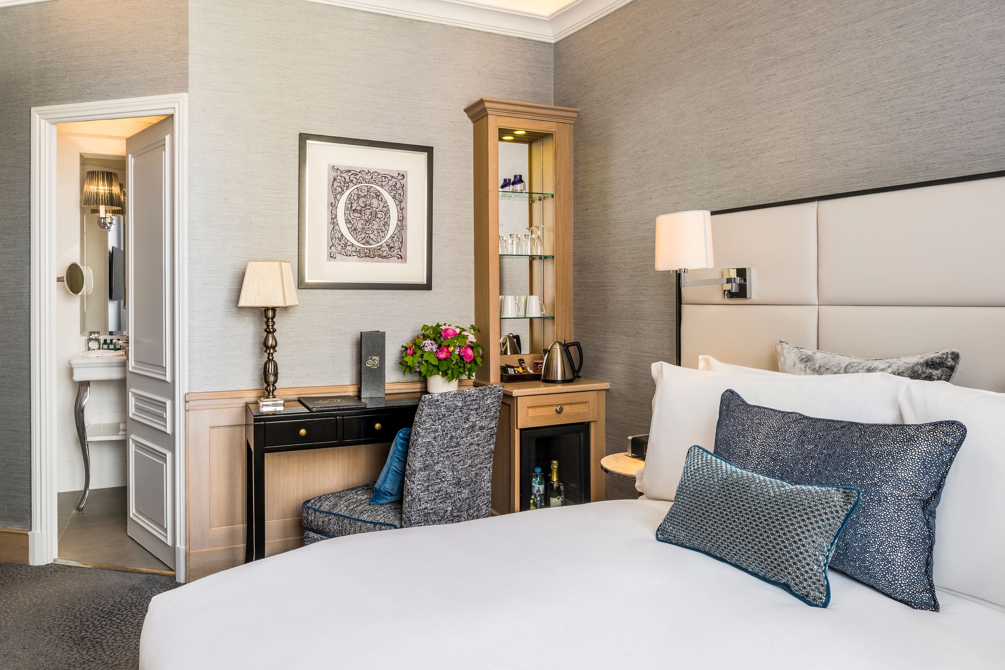 a bedroom with a bed and a desk