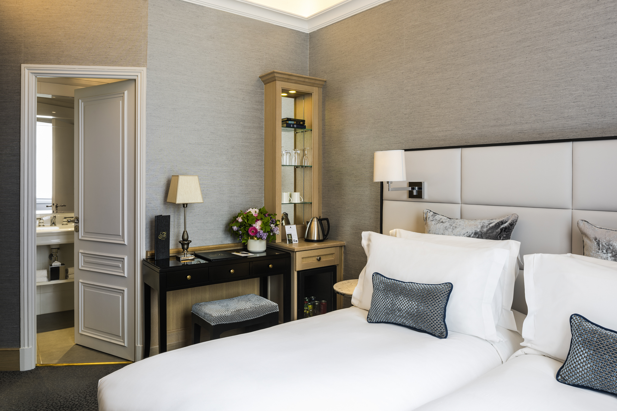 a bedroom with a bed and a table