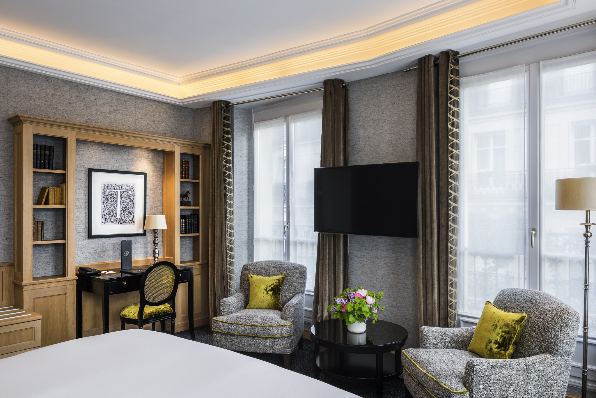 a room with a bed and a television