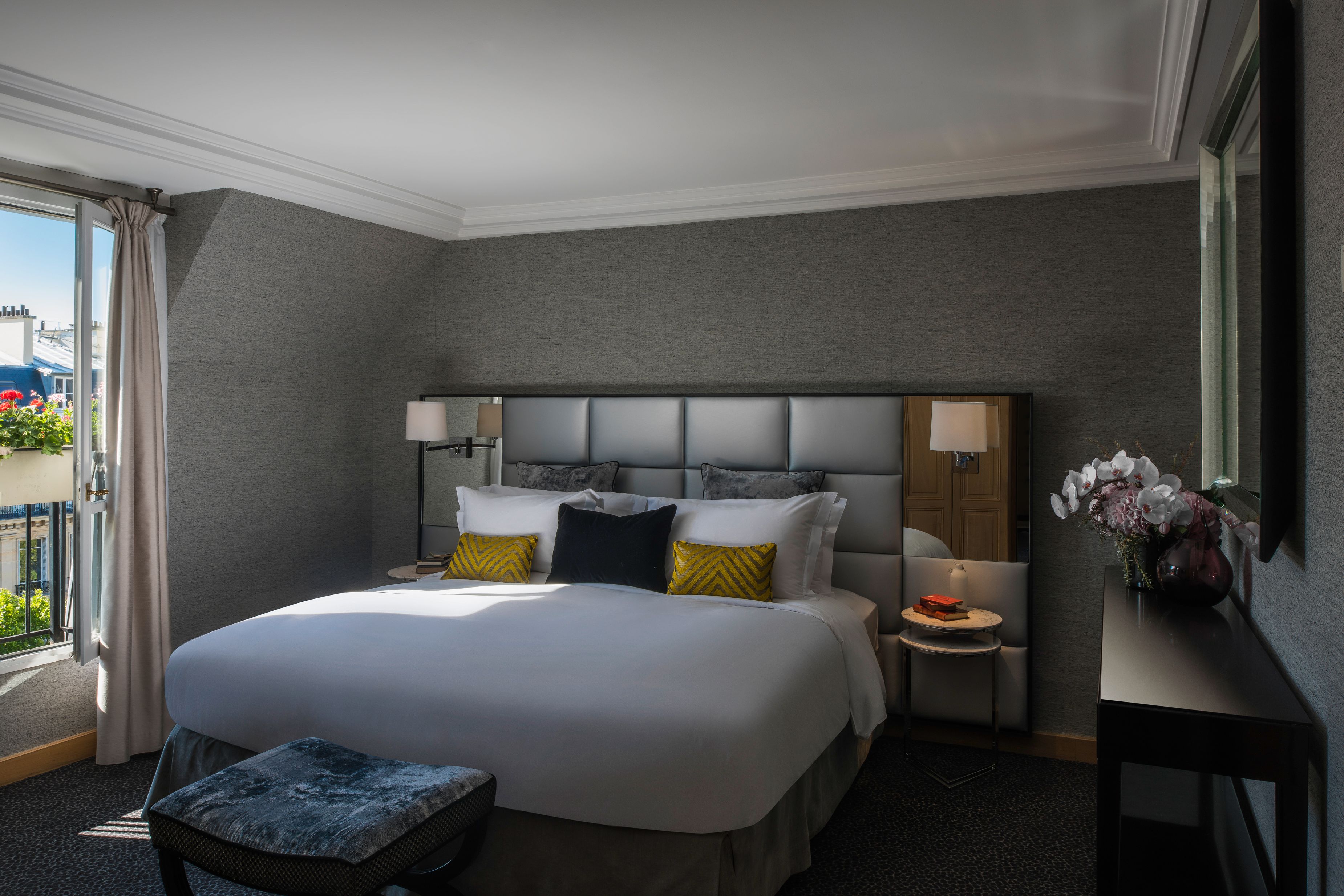 a bed with pillows in a room
