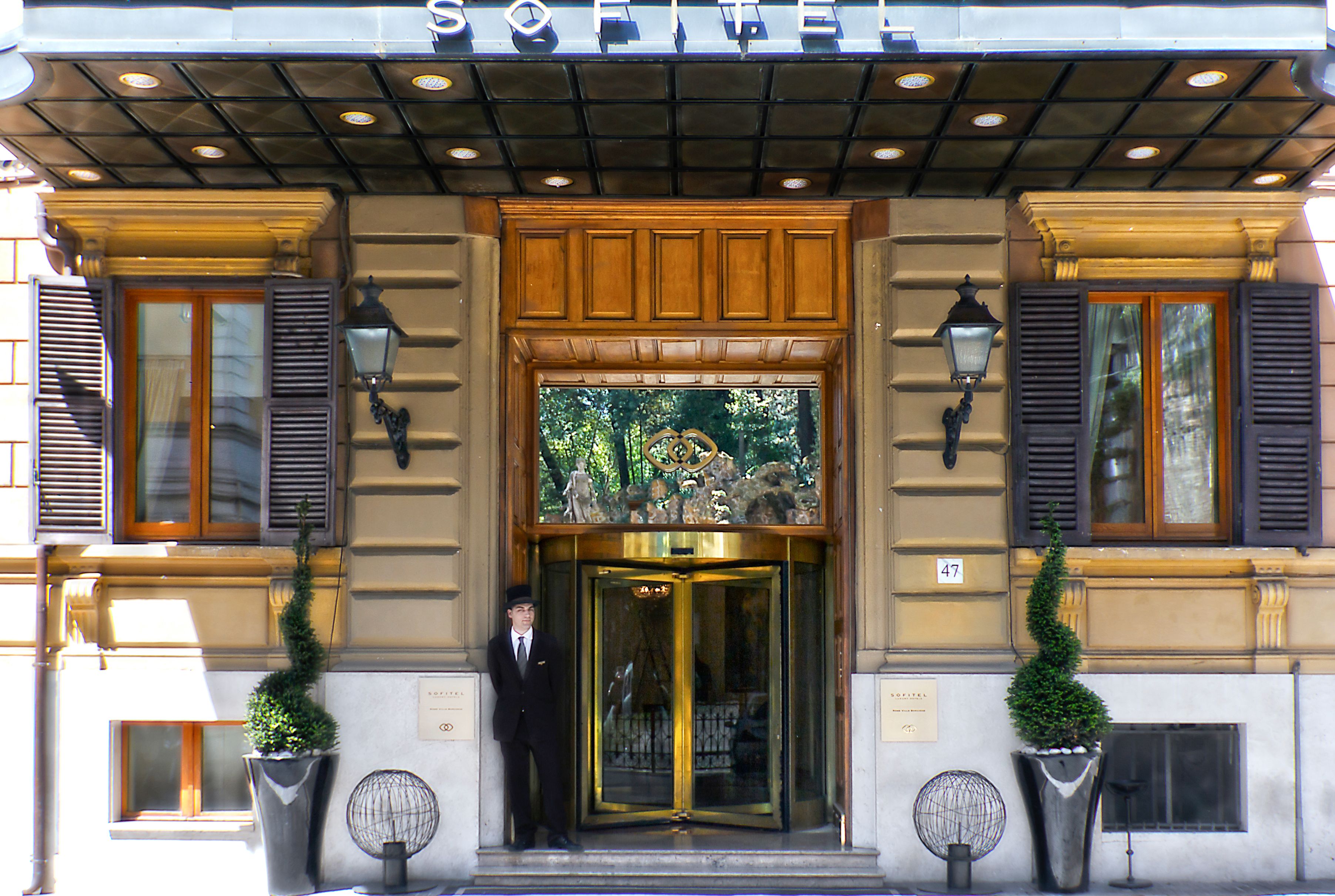 a man standing in front of a building