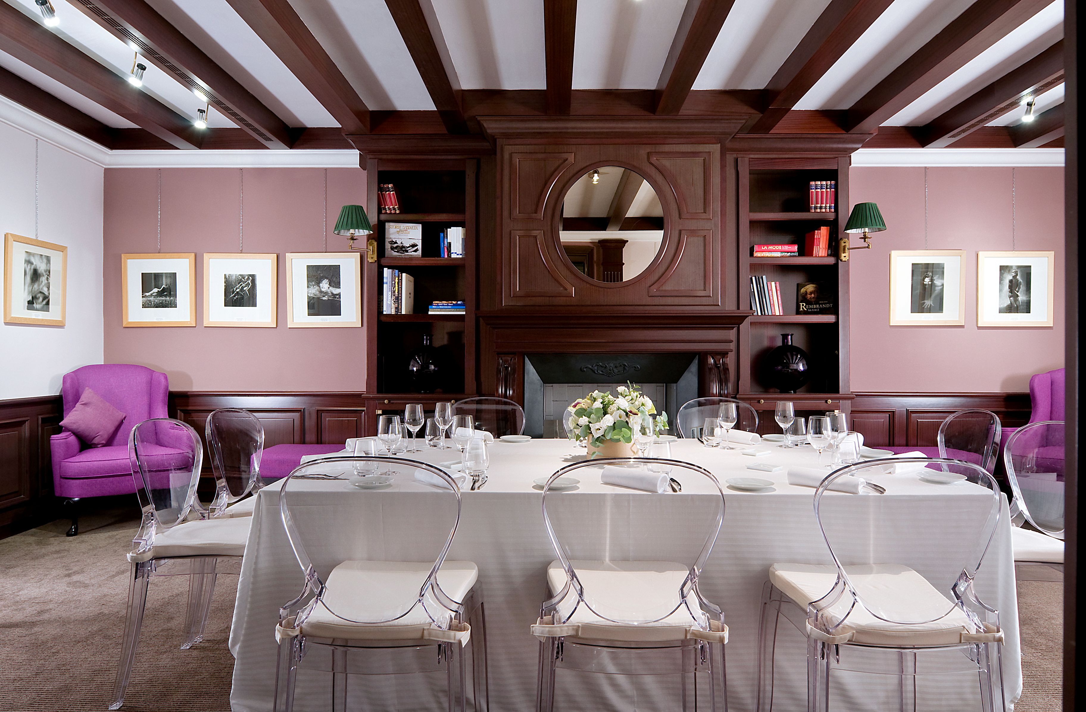 a room with a table set for a dinner