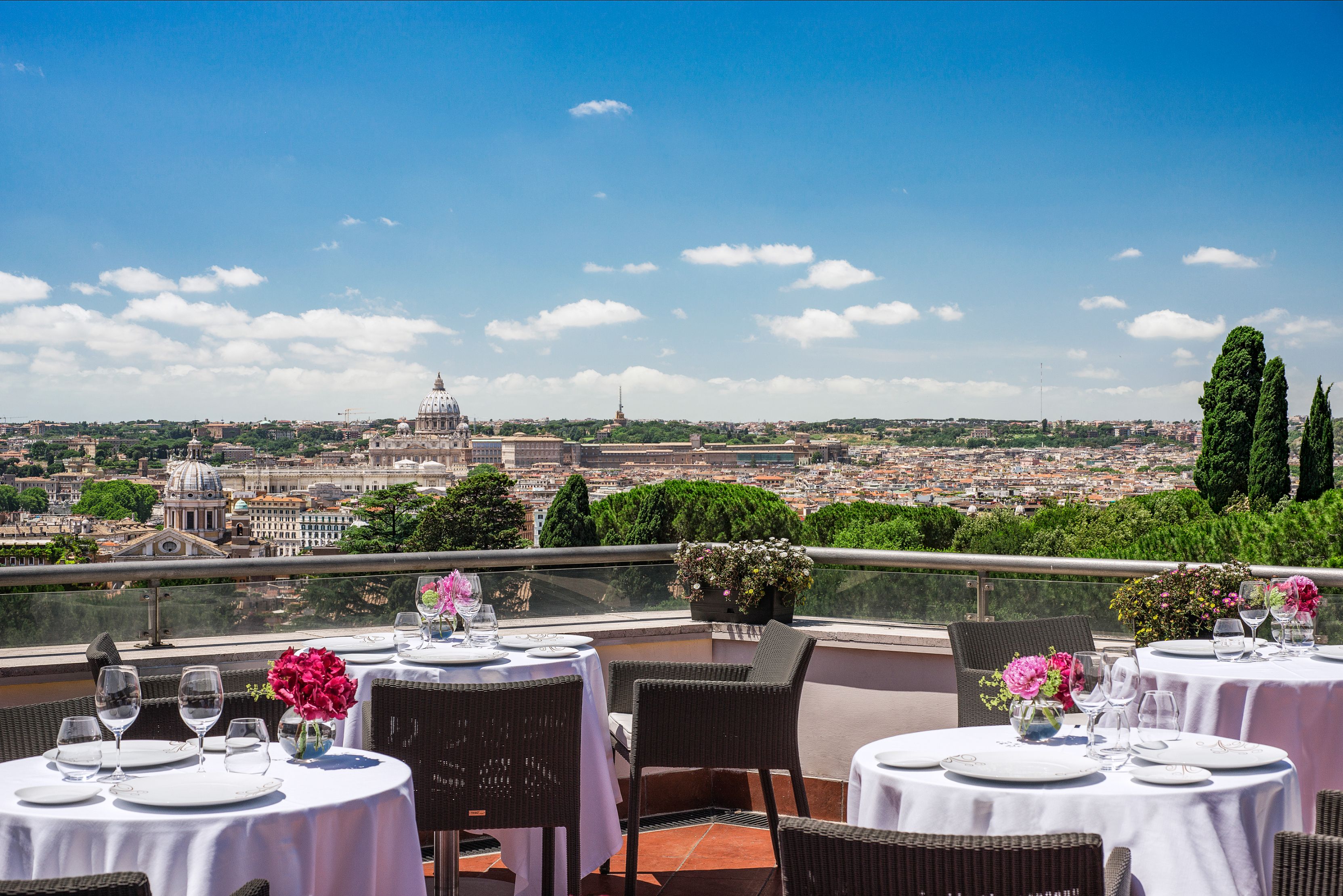 a table set up on a rooftop overlooking a city