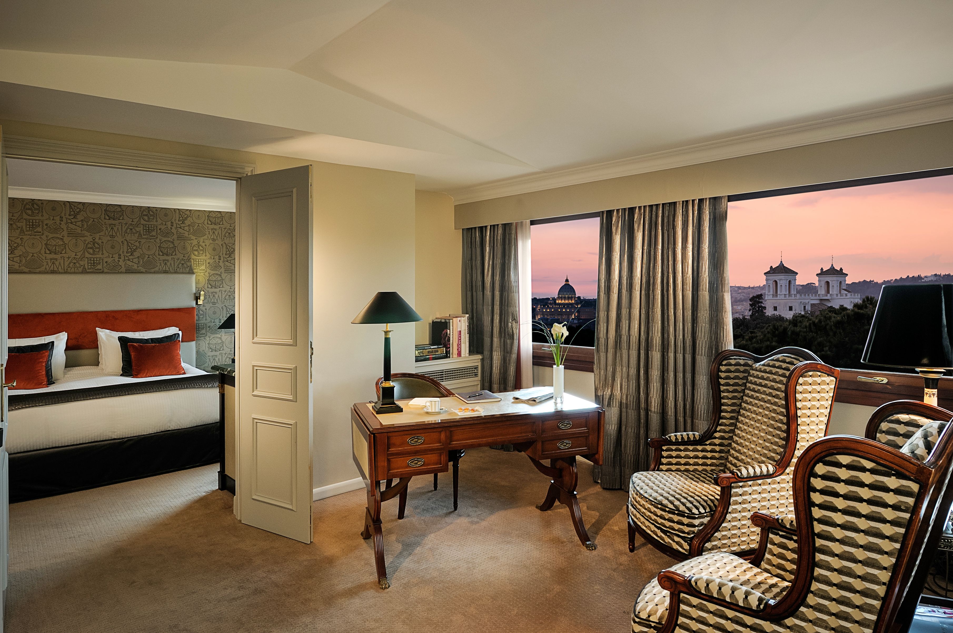 a room with a desk and chairs