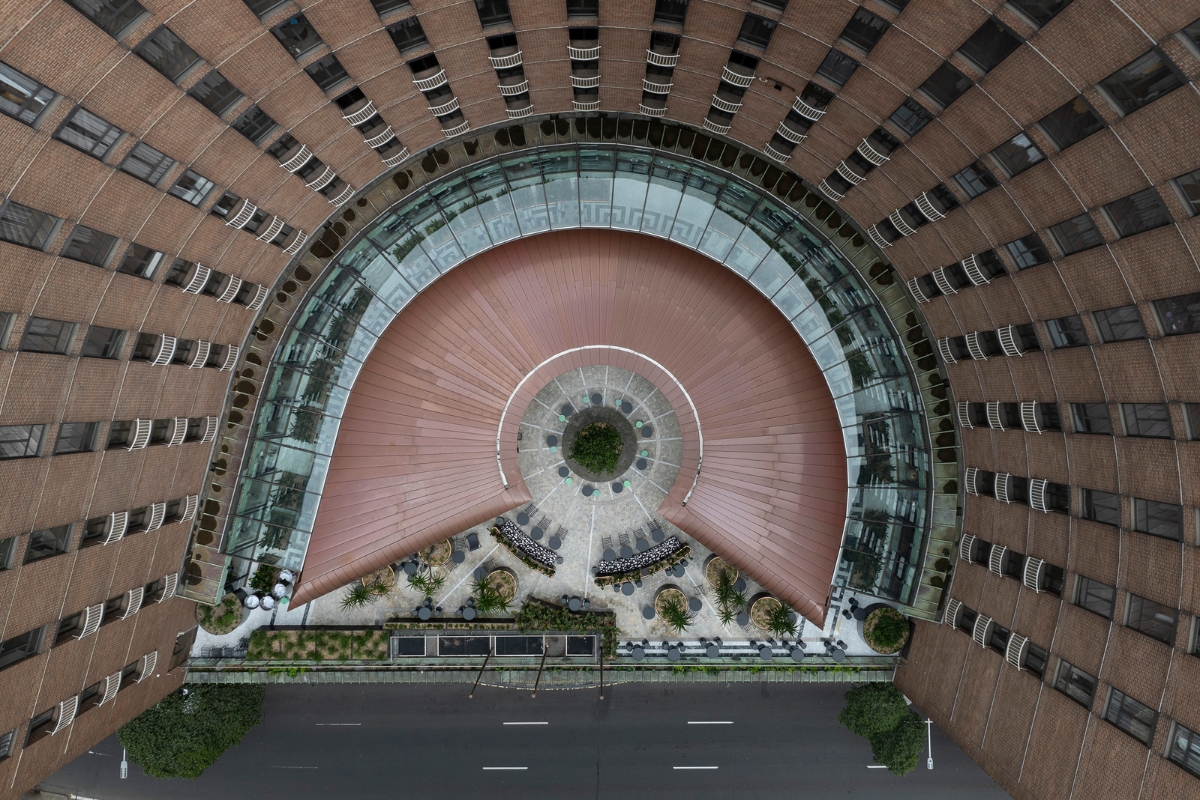 a circular building with a circular walkway and a road