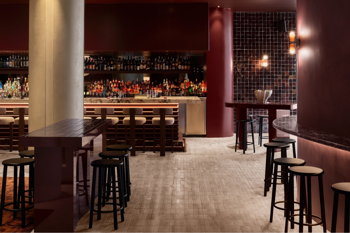 a bar with a counter and stools