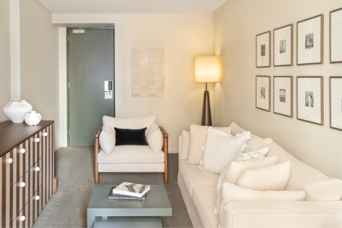 a living room with a couch and a lamp