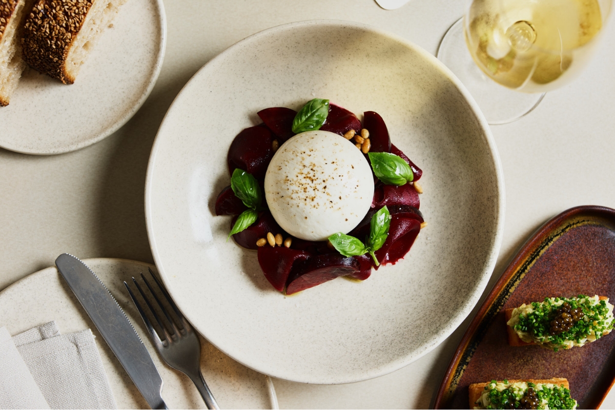 a plate of food with a white ball on top